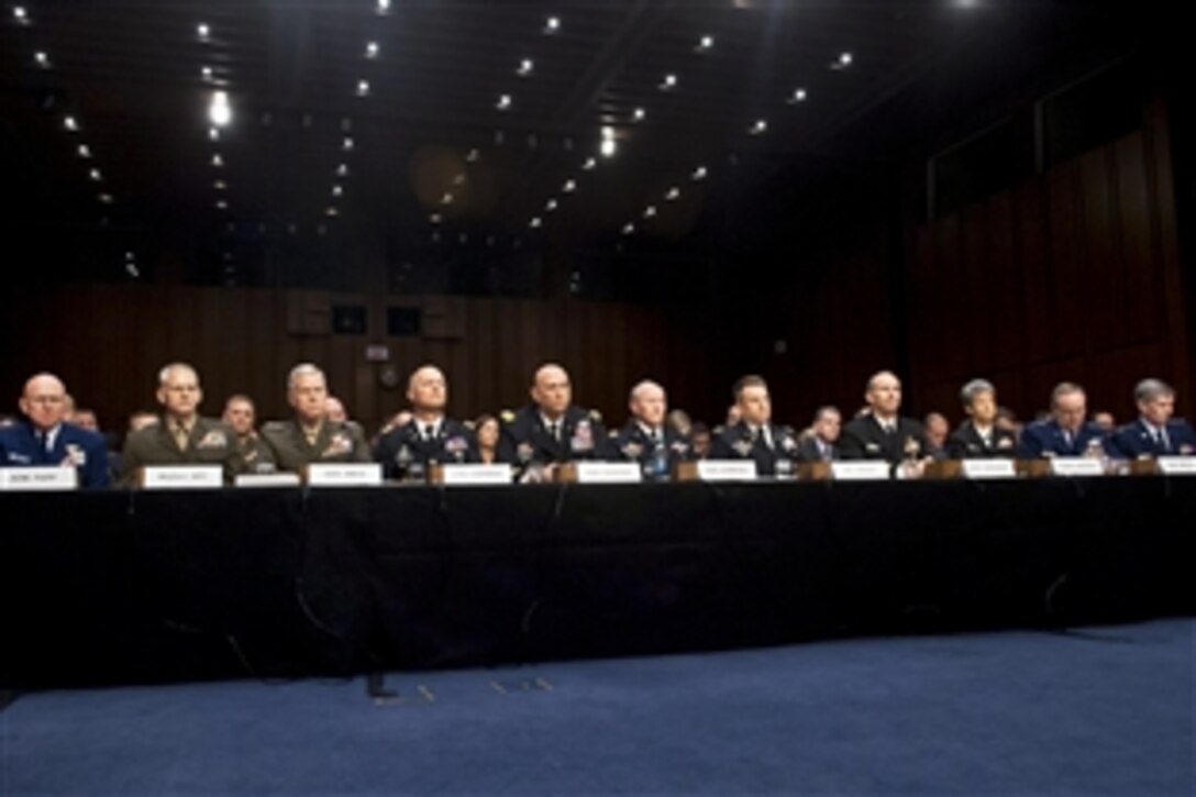 Military leaders, including Army Gen. Martin E. Dempsey, sixth from left, chairman of the Joint Chiefs of Staff, testify on sexual assault in the military before the Senate Armed Services Committee in Washington, D.C., June 4, 2013.