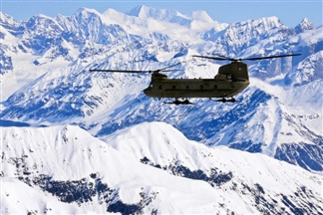 A U.S. Army Alaska Aviation Task Force CH-47 Chinook helicopter flies along the Alaska Range on its way to Kahiltna Glacier, Alaska, on May 20, 2013.  A team of eight soldiers and one Army civilian from Fort Wainwright are being transported to the National Park Service base camp on the glacier to begin their attempt to climb North America's tallest peak Mount McKinley.  The team members are representatives of U.S. Army Alaska's Northern Warfare Training Center and the 1st Stryker Brigade Combat Team, 25th Infantry Division.  The Chinook is attached to B Company, 1st Battalion, 52nd Aviation Regiment.  