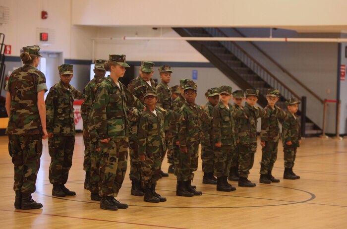 Members of the Young Marines program align themselves in formation during the class’ graduation aboard Camp Lejeune, N.C., June 1, 2013. The graduates learned about and practiced many of the Marine Corps’ traditions and physical exercises, including the physical fitness test and drill. 