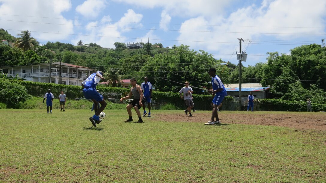 A team from the Boys Training Centre faces off in a friendly game of futbol with crewmembers of the U.S. Coast Guard Cutter Oak. The Boys Training Center is sponsored by the USAID under the Juvenile Justice Reform Program. USAID’s Juvenile Justice Reform Program seeks to reduce recidivism rates among youth offenders and to increase the chances of youth who have had run-ins with the law to transform themselves into citizens who contribute positively to society. Tradewinds 2013 is a joint, combined exercise conducted in conjunction with partner nations to enhance the collective abilities of defense forces and constabularies to counter transnational organized crime and to conduct humanitarian/disaster relief operations. (Official Marine Corps Photo by Staff Sgt. Sgt. Earnest J. Barnes/Released)