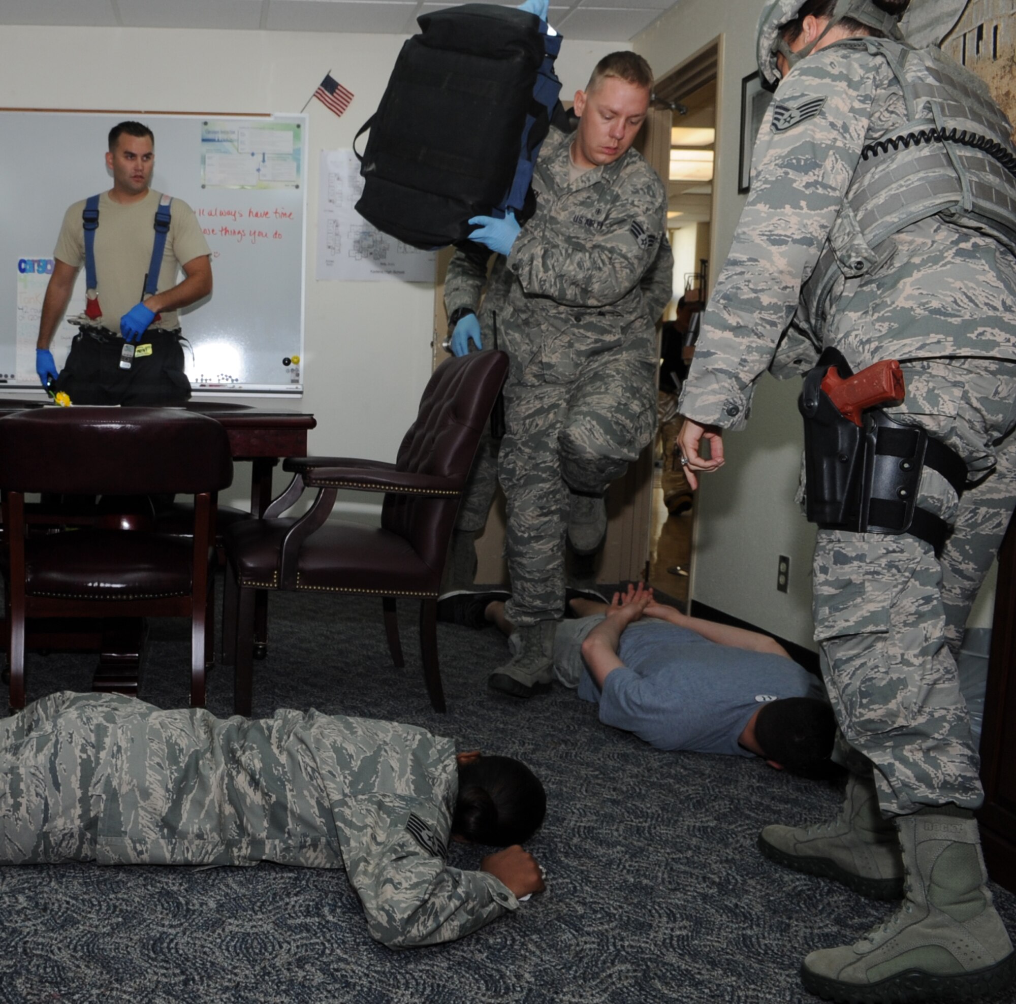 Kadena first response forces respond to an active-shooter training scenario at Kadena High School on Kadena Air Base, Japan, June 6, 2013. The training scenario provided a real-world situation that allowed the responders to sharpen their skills and gain critical experience to better prepare and execute when real-world situations occur. (U.S. Air Force photo by Airman 1st Class Keith A. James/Released) 