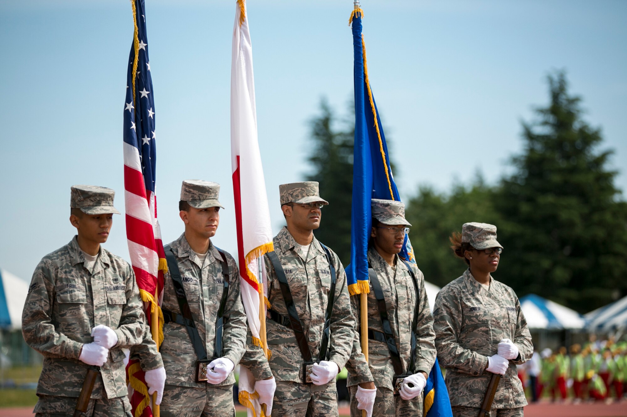 YOKOTA AIR BASE, Japan -- Yokota's Honor Guard posts the colors in the opening ceremony of the Kanto Plain Special Olympics 2013. Yokota has hosted the Special Olympics for 30 years; more than 1500 people assembled at Yokota High School's Bonk Field to support and participate. The event started out with only three participants in 1980, and has grown to 150 participants and countess volunteers and supporters. (U.S. Air Force photo by Airman 1st Class Alexander Archer)