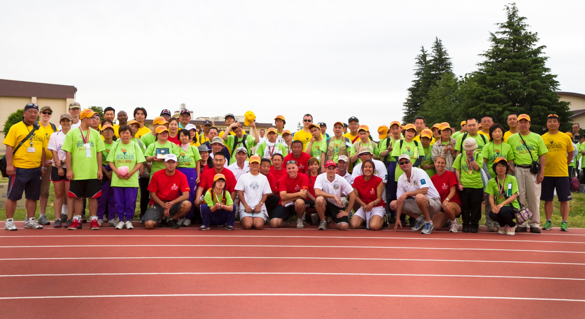YOKOTA AIR BASE, Japan -- Athletes and volunteers assemble at Yokota High School's Bonk Field to support and participate in the 34th Annual Kanto Plain Special Olympics at Yokota Air Base, Japan, June 1, 2013. U.S. Armed Forces, Department of Defense employees and Japanese volunteers joined spectators to assist and encourage the Special Olympians from around Japan. (U.S. Air Force photo by Senior Airman William Johnson)