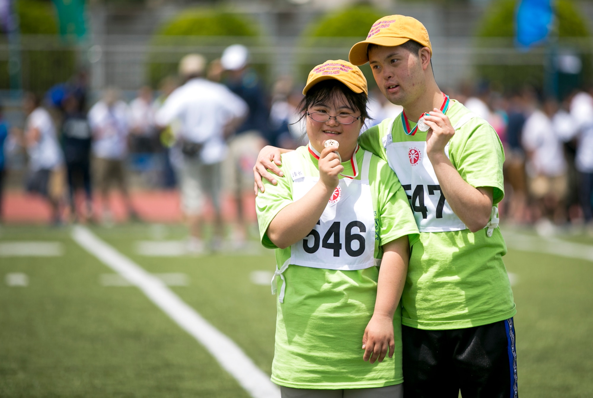 YOKOTA AIR BASE, Japan -- Special Olympic athletes pose for photos with their metals during the Kanto Plains Special Olympics held at Yokota Air Base, Japan, June 1, 2013. The event started out with only three participants in 1980, and has grown to over 150 competitors in this year's games. (U.S. Air Force photo by Airman 1st Class Alexander Archer)