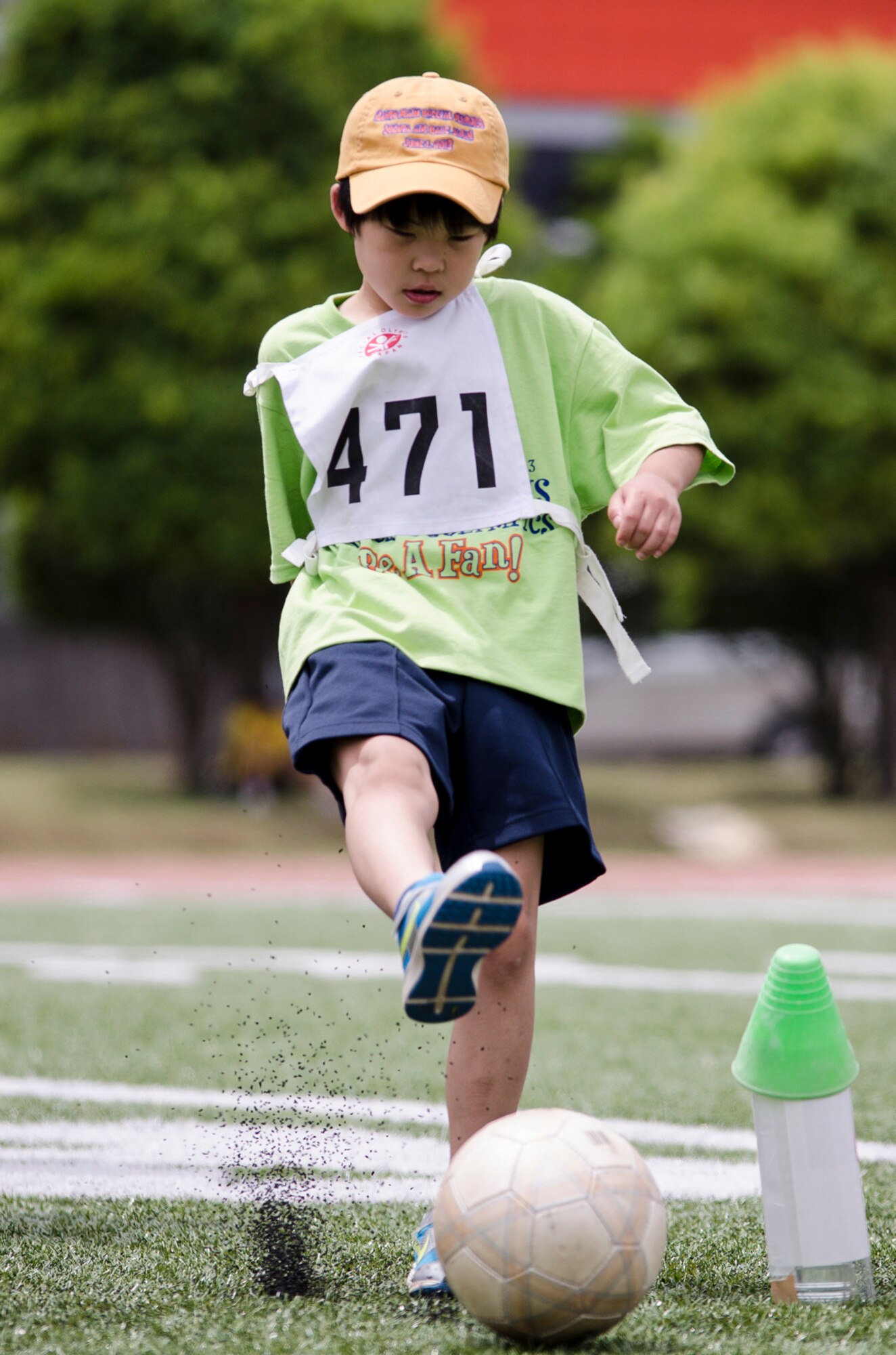 YOKOTA AIR BASE, Japan -- A Special Olympics athlete kicks a soccer ball during the Kanto Plains Special Olympics held at Yokota Air Base, Japan, June 1, 2013. Additional events during the day also included swimming, basketball and track and field events. (U.S. Air Force photo by Staff Sgt. David Gevert)