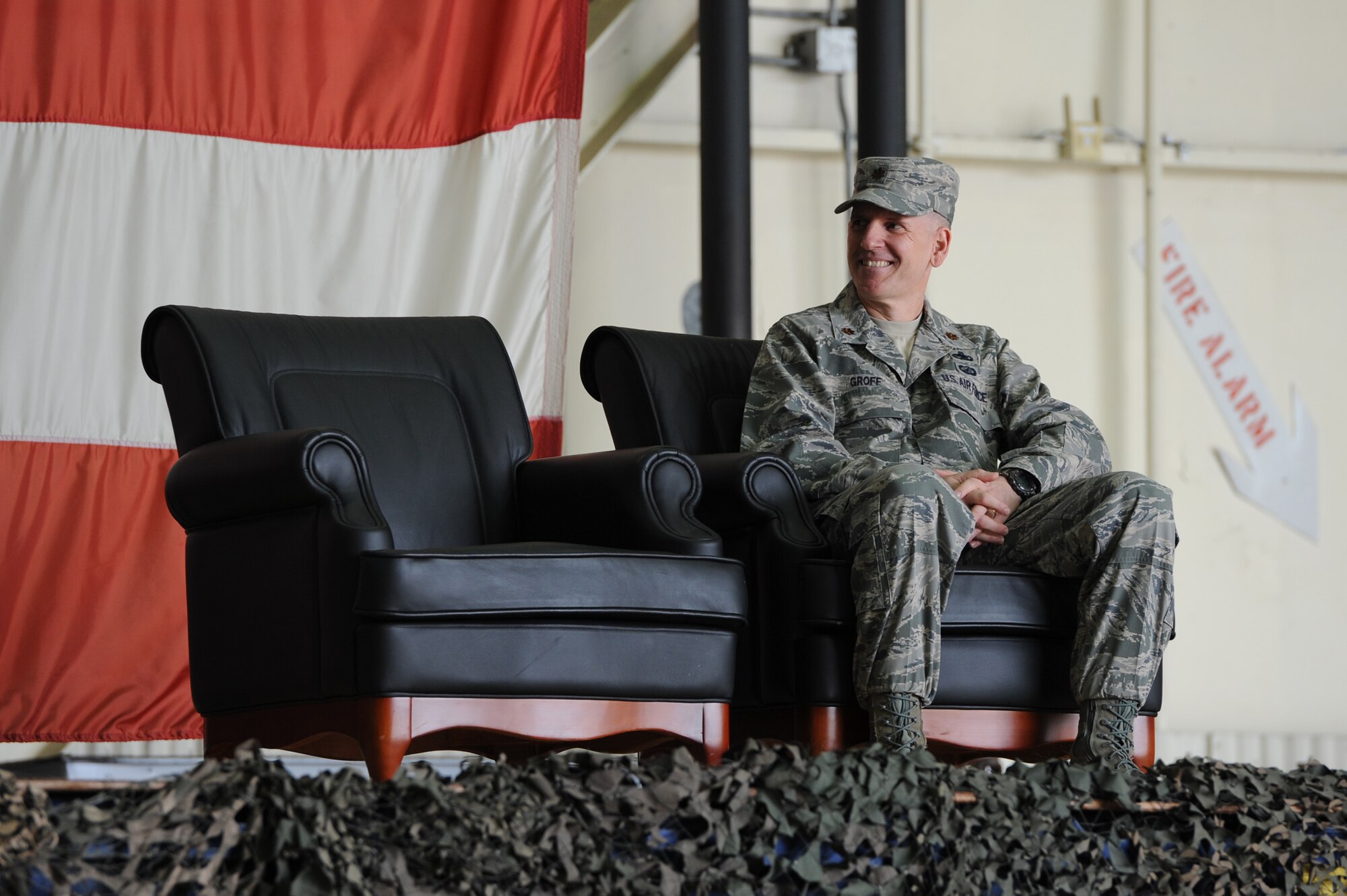 Maj. John Groff, 8th Maintenance Operations Squadron commander, reacts to Col. Ray Lindsay, 8th Maintenance Group commander, speaking during the 8th MOS deactivation ceremony at Kunsan Air Base, Republic of Korea, May 31, 2013. Groff will be the last commander with the call sign “Knight.” (U.S. Air Force photo by Staff Sgt. Jonathan Fowler/Released)