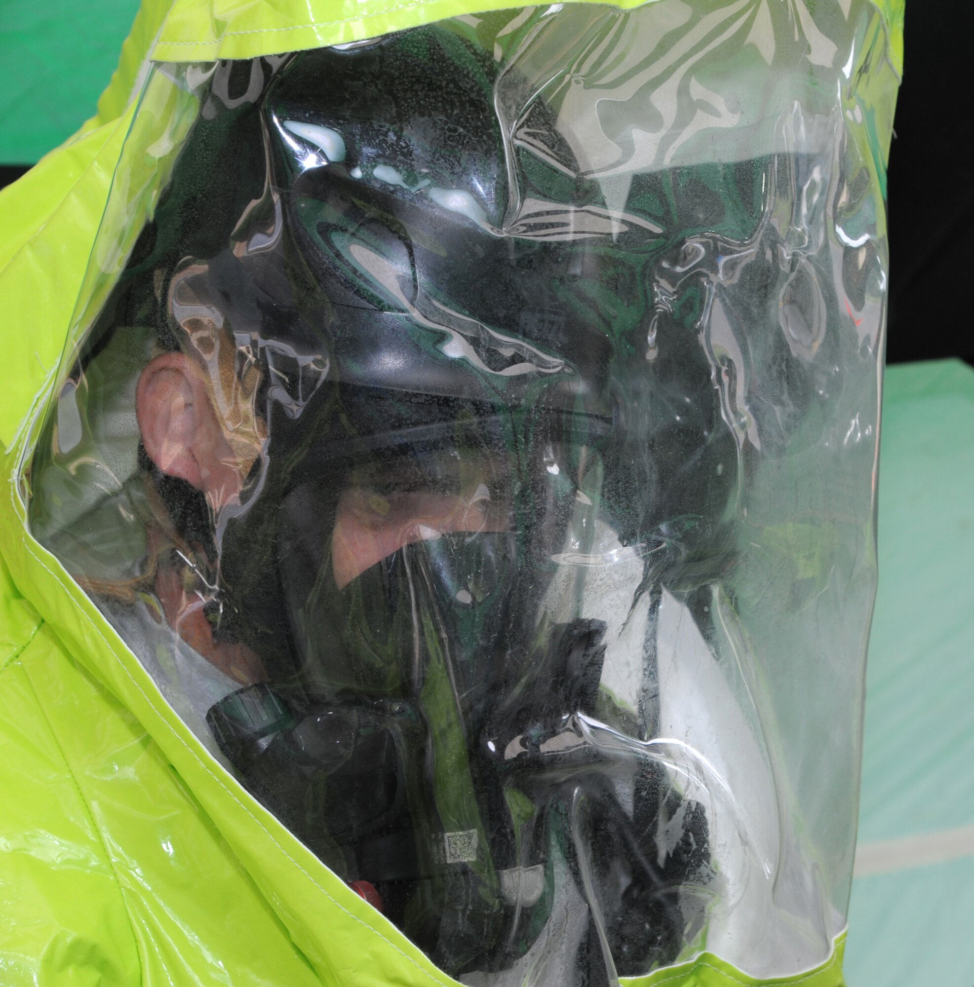 Col. Darren James, the 71st Flying Training Wing commander, tries on a Level-A suit, complete with 20-pound respiratory tank, during a chemical-threat exercise with the 71st Logistics Readiness Squadron and the 71st Medical Group, June 3, at Vance Air Force Base, Okla. (U.S. Air Force photo/ Senior Airman Frank Casciotta)