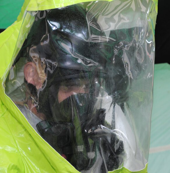 Col. Darren James, the 71st Flying Training Wing commander, tries on a Level-A suit, complete with 20-pound respiratory tank, during a chemical-threat exercise with the 71st Logistics Readiness Squadron and the 71st Medical Group, June 3, at Vance Air Force Base, Okla. (U.S. Air Force photo/ Senior Airman Frank Casciotta)