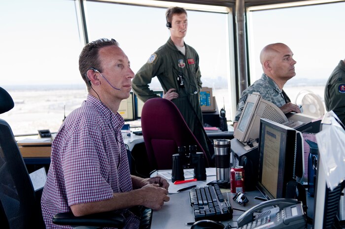 Darrell Browning, 57th Operations Support Squadron tower watch supervisor, observes aircraft activity during a Joint Forcible Entry exercise May 31, 2013 on the Nellis Air Force Base runway.  Air traffic control tower personnel oversaw the safe launch and recovery of more than 40 aircraft during the exercise. (U.S. Air Force Photo by Caitlin Kenney)