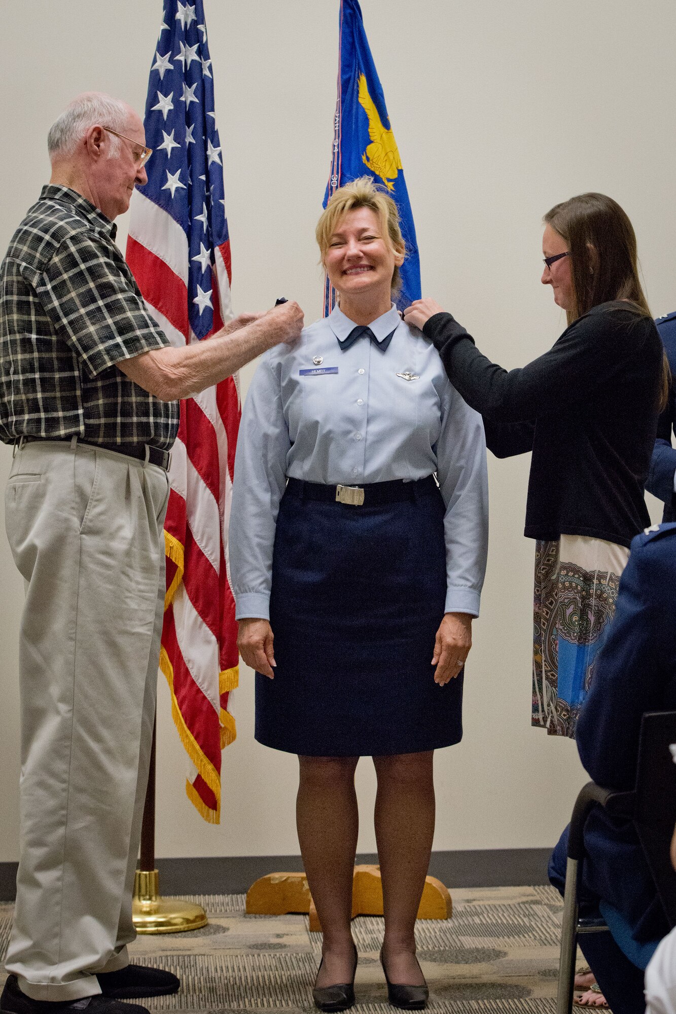 Col. Sherry Hemby, 934th Aeromedical Evacuation Squadron commander, gets her rank pinned on by her father, Robert Hemby and her niece Katlyn Brown.  Col. Hemby celebrated her promotion during a ceremony at the Minneapolis-St. Paul Air Reserve Station, Minn. (U.S. Air Force photo/Staff Sgt. Samantha Wagner)