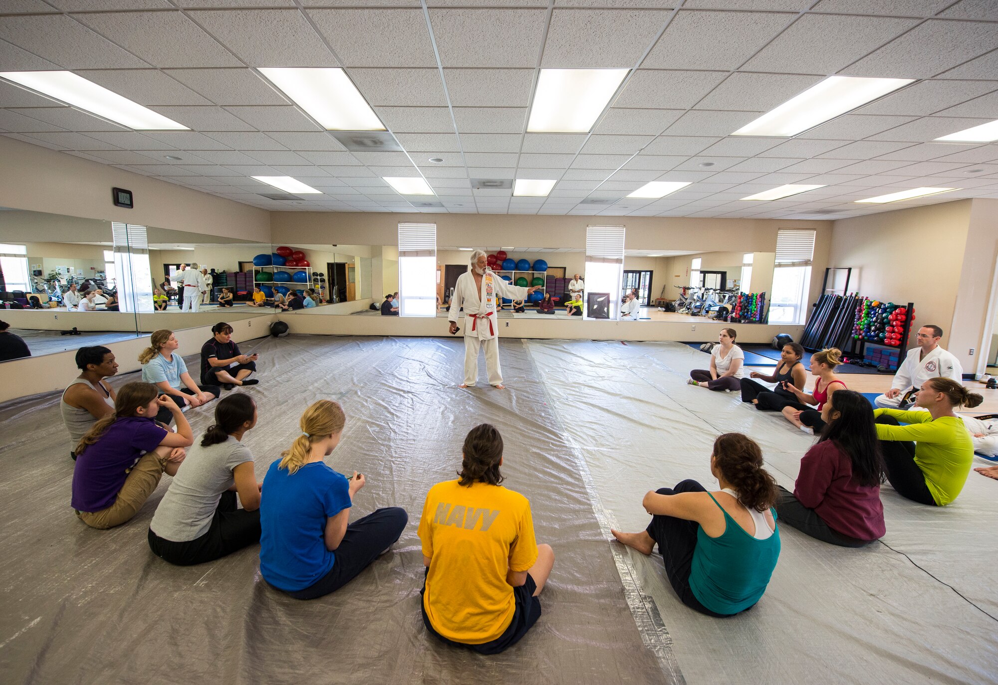 Dr. Ronald Charles, Judo and Jujitsu instructor, teaches participants about self defense techniques during the Women's Self Defense Seminar June 1, 2013, at Joint Base Charleston – Weapons Station, S.C. Black belt instructors experienced in Judo and Jujitsu presented the free seminar that included street survival techniques and various methods of self defense as well as commercially available weapons and instruction on improvising weapons. (U.S. Air Force photo/ Senior Airman George Goslin)

