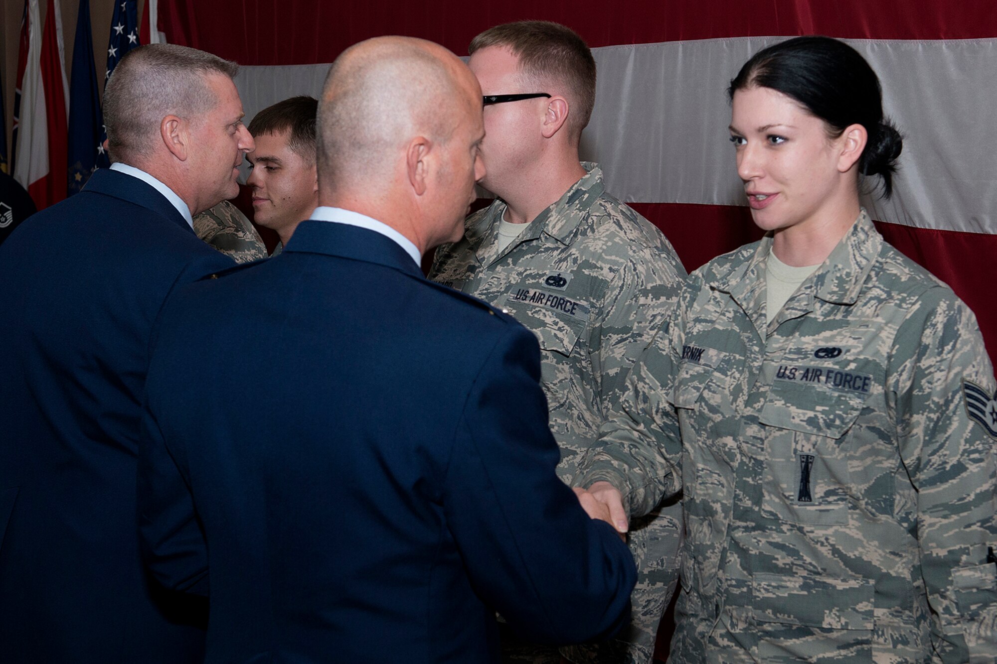 U.S. Air Force Col. Jonathan Ellis, 307th Bomb Wing (BW) commander, and Chief Master Sgt. Randall Noble, 307th BW command chief, congratulate Weapons Load Crew members Staff Sgt. Erin Bernik, Tech. Sgts. Matthew Bailey and Donald Ballard, and Master Sgt. James Hudson, during a ceremony held on June 2, 2013, Barksdale Air Force Base, La. The crew members are assigned to the 707th Maintenance Squadron and were selected as the 2012 Air Force Reserve Command Outstanding Weapons Load Crew of the Year. (U.S. Air Force photo by Master Sgt. Greg Steele/Released)