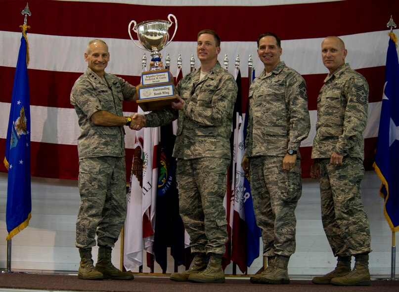 MINOT AIR FORCE BASE, N.D. -- Lt. Gen. James Kowalski, commander of Air Force Global Strike Command, presents the Castle Trophy to the 5th BW commander, Alexis Mezynski. (U.S. Air Force photo/Senior Airman Brittany Y. Auld)