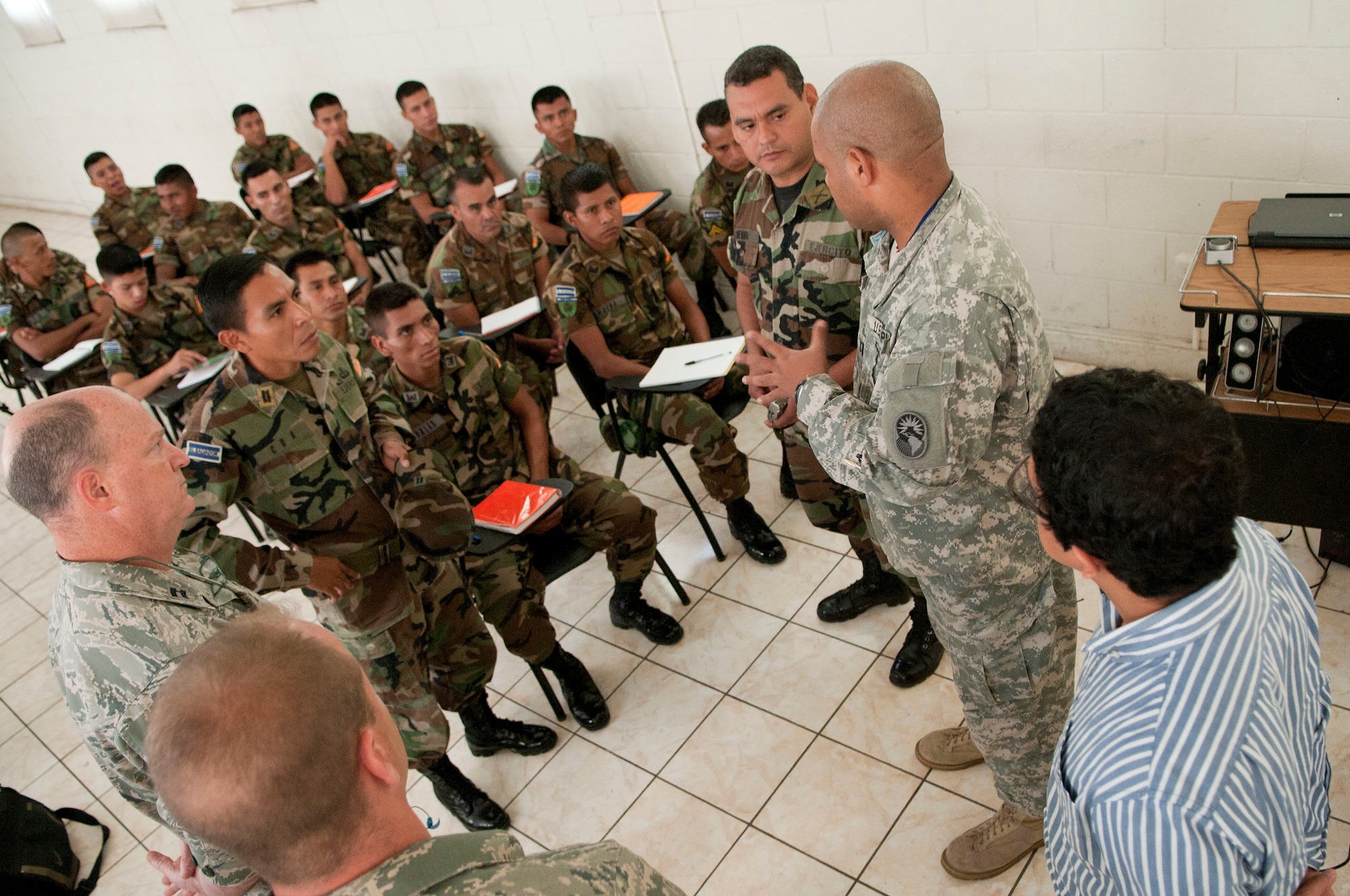 N.H. Army National Guard Capt. Jose Mendez (right) coordinates search and extraction training information for members of the 157th Air Refueling Wing and the Salvadoran military, San Salvador, El Salvador, June 26, 2012.  Mendez is the N.H. National Guard Bi-Lateral Affairs Officer for the N.H. State Partnership Program. (Air National Guard photo by Tech. Sgt. Mark E. Wyatt/Released)