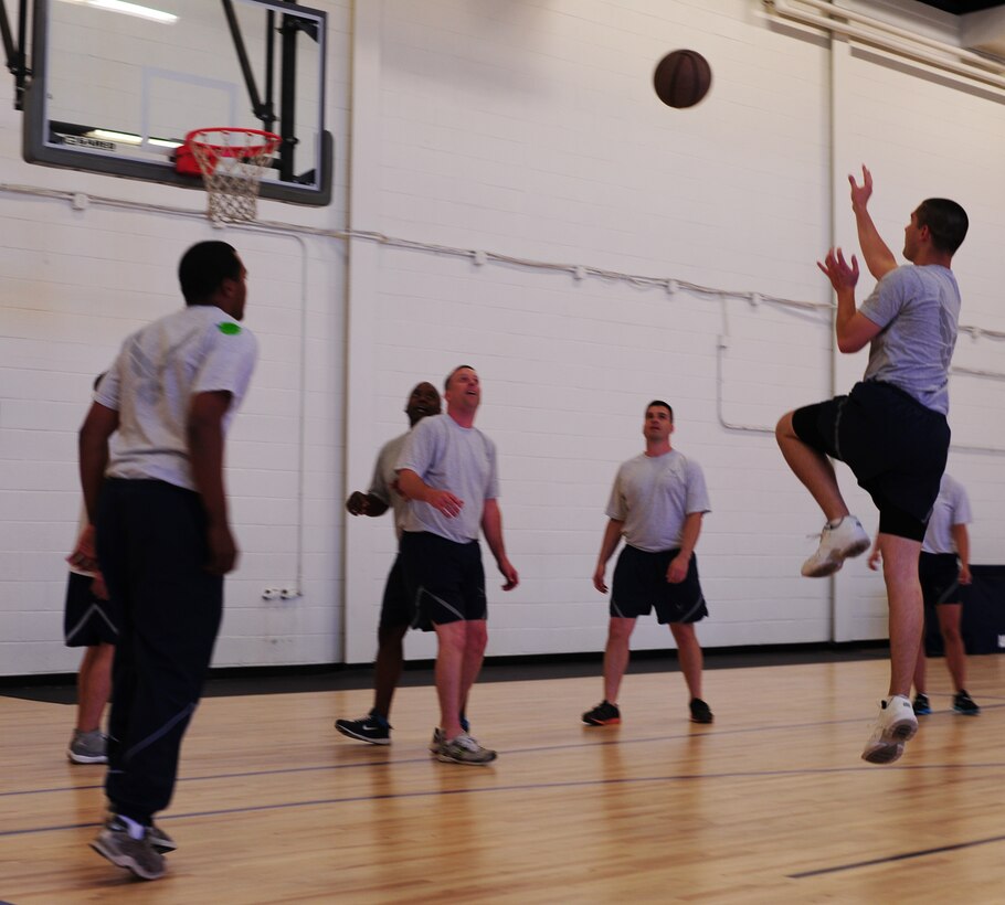 Team Andrews service members play team sports during Wingman Day on Joint Base Andrews, Md., June 4, 2013. Wingman Day is designed to teach airmen and coworkers to work with individuals who have similar or conflicting personalities to their own. Airmen and civilians participated in various activities as a way to channel better communication within their units. (U.S. Air Force photo/Airman 1st Class Erin O’Shea)  