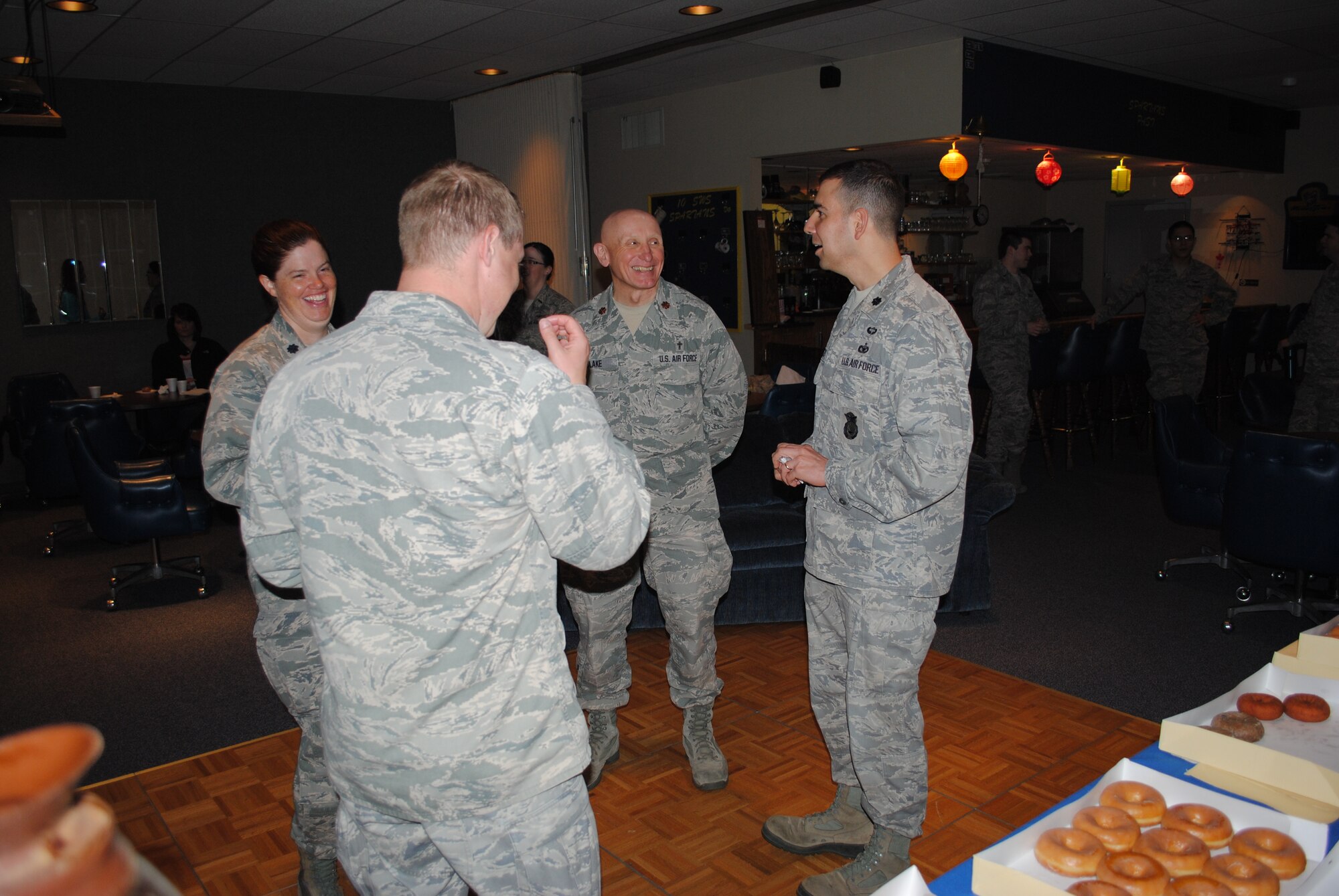 (Right) Lt. Col. Frank Reyes, 319th Security Forces Squadron commander, and Chaplain (Maj.) Lawrence Blake, center, visit 10th Space Warning Squadron Commander Lt. Col. Lorinda Frederick and Capt. Daniel Weeks during a routine morale visit at Cavalier Air Force Station, N.D., on May 31, 2013. The 319th SFS and other organizations from Grand Forks Air Force Base, N.D., provide support to the 10th SWS. (U.S. Air Force photo/Staff Sgt. Luis Loza Gutierrez) 
