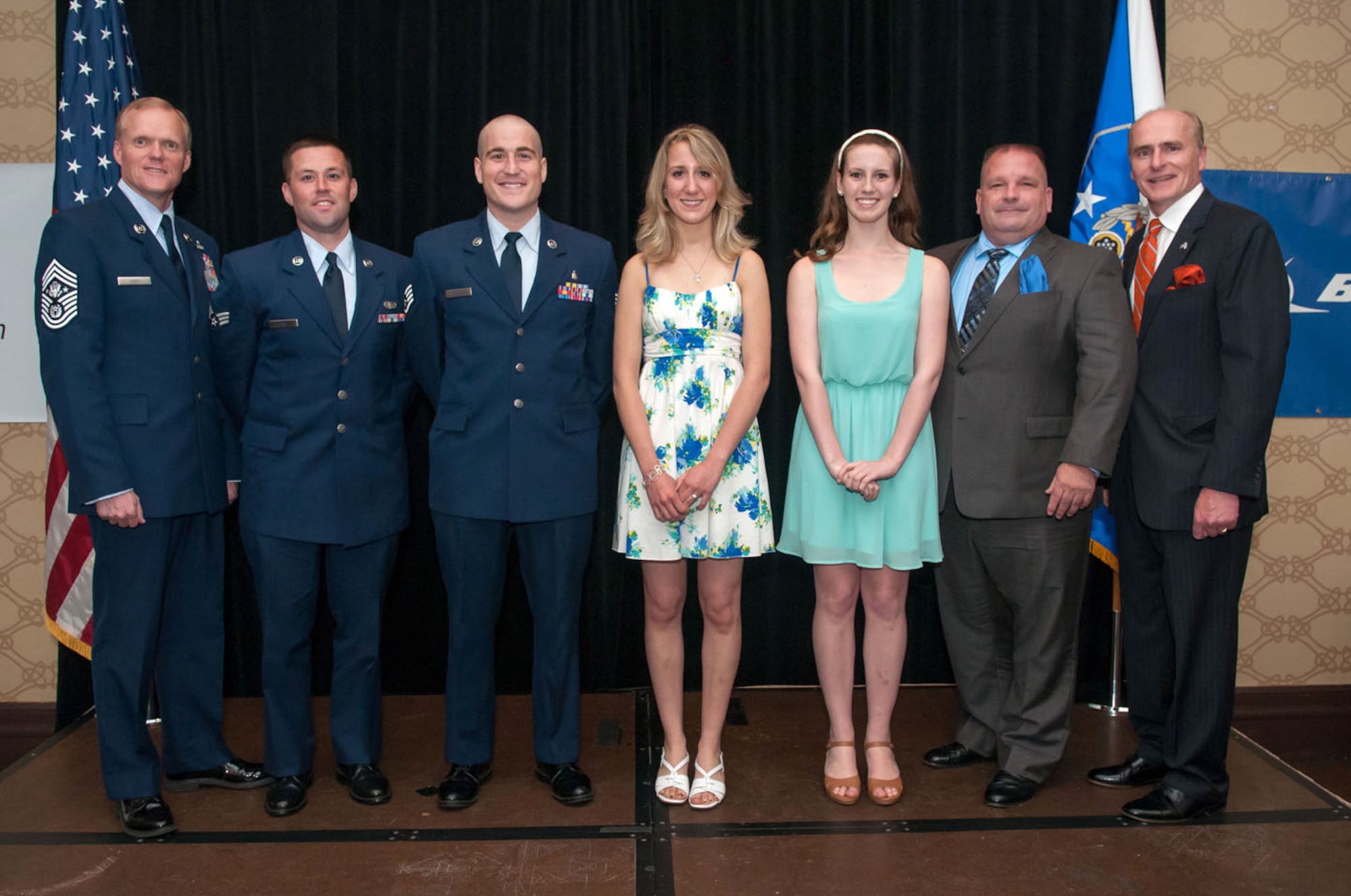 BEDFORD, Mass. -- Chief Master Sgt. of the Air Force James A. Cody (left) stands with scholarship recipients at the Air Force Association's Chief of Staff Scholarship Dinner May 29 along with Keith Taylor (right), AFA Paul Revere Chapter president. Chief Cody was the keynote speaker and presented scholarships to three graduating high school seniors and two Airmen assigned at Hanscom Air Force Base. Receiving scholarships were: (from left to right) Senior Airman John Fay, $500; Staff Sgt. Justin Beckett, $500; Erika Hill, $5,000 Chief of Staff Scholarship; Halie LeSavage, $4,500 Chuck Jones Memorial Scholarship; Dr. Tom Kobylarz standing in for his daughter Karlie Kobylarz, $4,500 Brian Sweeney Memorial Scholarship. (U.S. Air Force photo by Rick Berry)