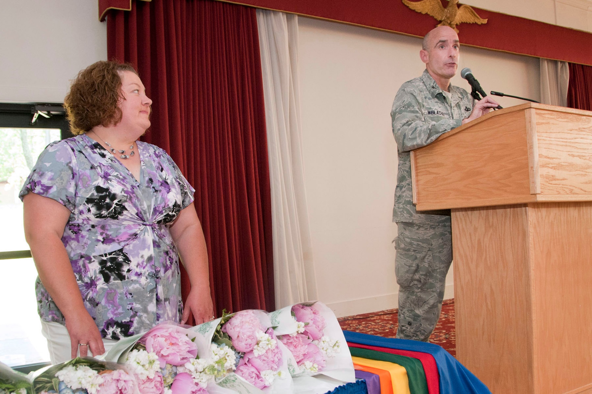 HANSCOM AIR FORCE BASE, Mass. -- Col. Lester A. Weilacher, 66th Air Base Group commander, thanks members of the Hanscom Spouses Club for service to the base community as Betsy Woolums, HSC outgoing president listens at the Minuteman Commons May 31. At the event, the HSC recognized Woolums and other board members, as well as incoming board members. New board members are Samantha McMenamy, secretary; Noel Grabell, second vice president; Erica House, president; Kelly Cooper, general treasurer; Erin Anderson, first vice president; and Rebecca Alonso, welfare treasurer (U.S. Air Force photo by Mark Wyatt)