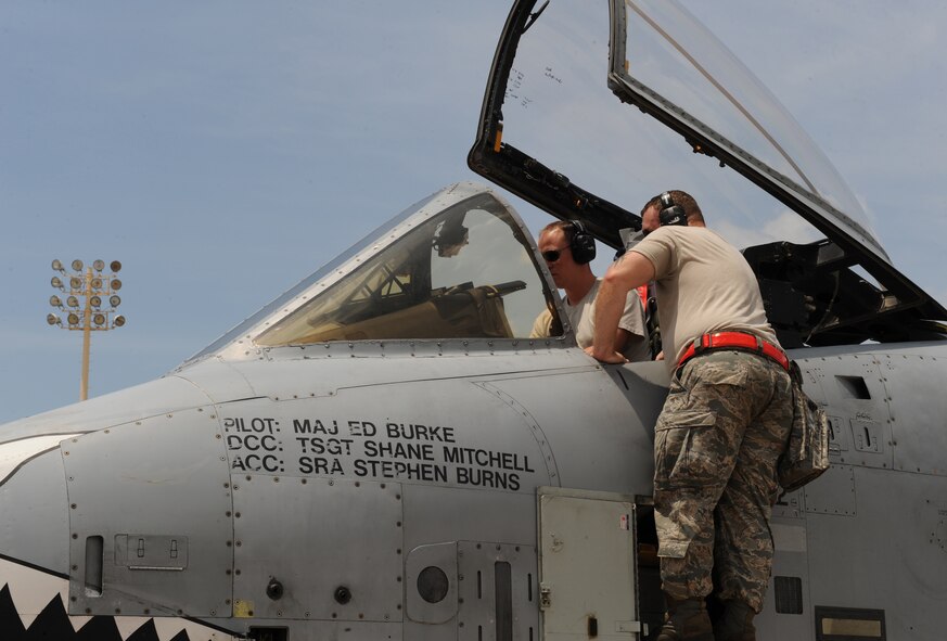 Maintainers from Moody Air Force Base, Ga., fix a discrepancy inside an A-10 Thunderbolt II fighter on Barksdale Air Force Base, La., June 4, 2013. Airmen from Moody are participating in the exercise Green Flag East. The exercise trains Airmen from different career fields to work together and prepare for deployments to combat environments. (U.S. Air Force photo/Airman 1st Class Benjamin Gonsier)