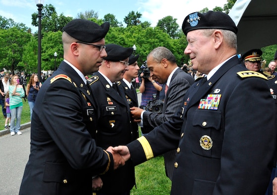 BOSTON – Gen. Frank J. Grass, Chief, National Guard Bureau and member of the Joint Chiefs of Staff thank 1st Lt. Steven D. Fiola, 1060th Transportation Company, for his efforts in response to the Boston Marathon Bombings during a ceremony on Boston Common June 3, 2013. Thirteen Massachusetts National Guardsmen and one New York Guardsman received awards during the ceremony. (U.S. Army National Guard photo by Sgt. 1st Class James C. Lally, Massachusetts National Guard Public Affairs/Released)