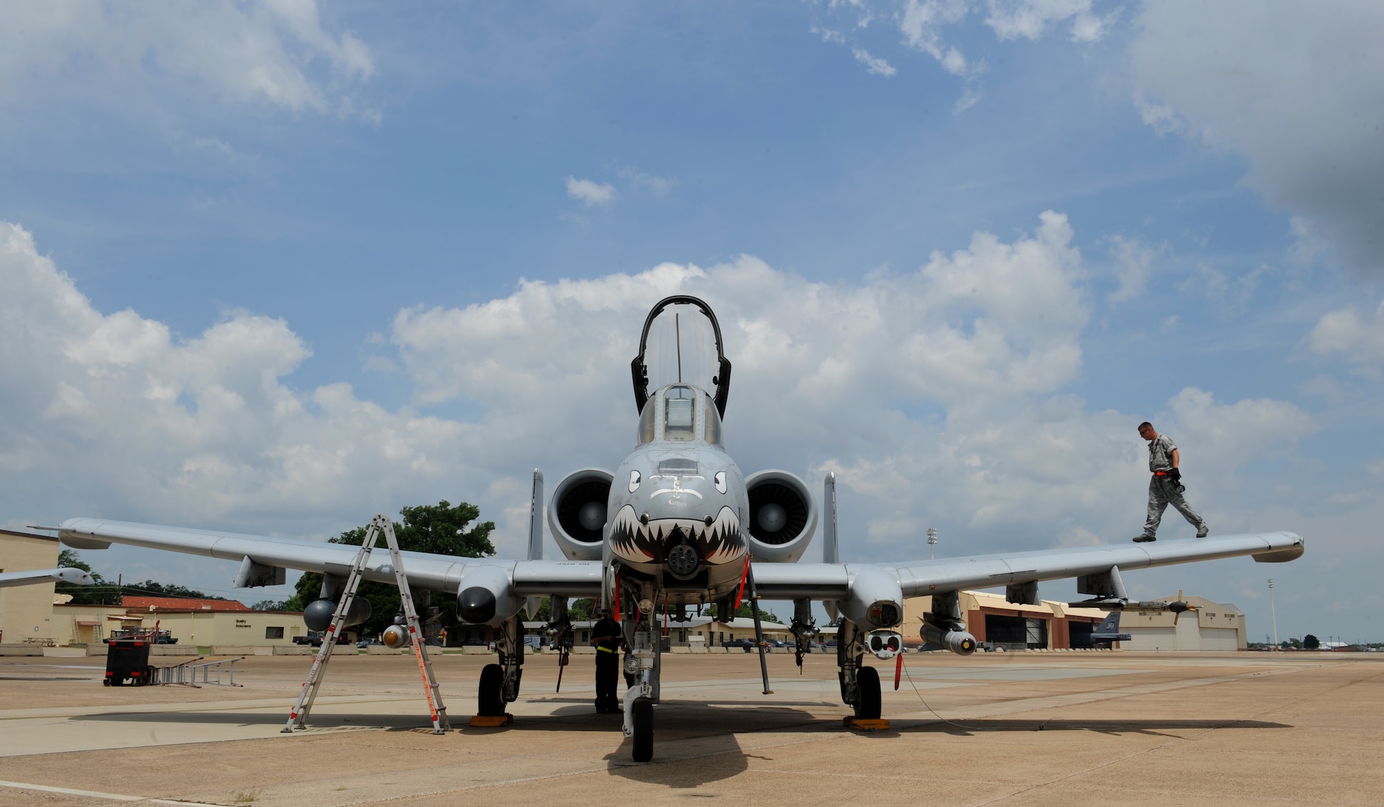 Senior Airman Jason Norris, a crew chief from Moody Air Force Base, Ga., walks on the wing of an A-10 Thunderbolt II fighter on Barksdale Air Force Base, La., June 4, 2013. Airmen from Moody are participating in Green Flag East, which gives aircrew the opportunity to train for future deployments. (U.S. Air Force photo/Airman 1st Class Benjamin Gonsier)  
