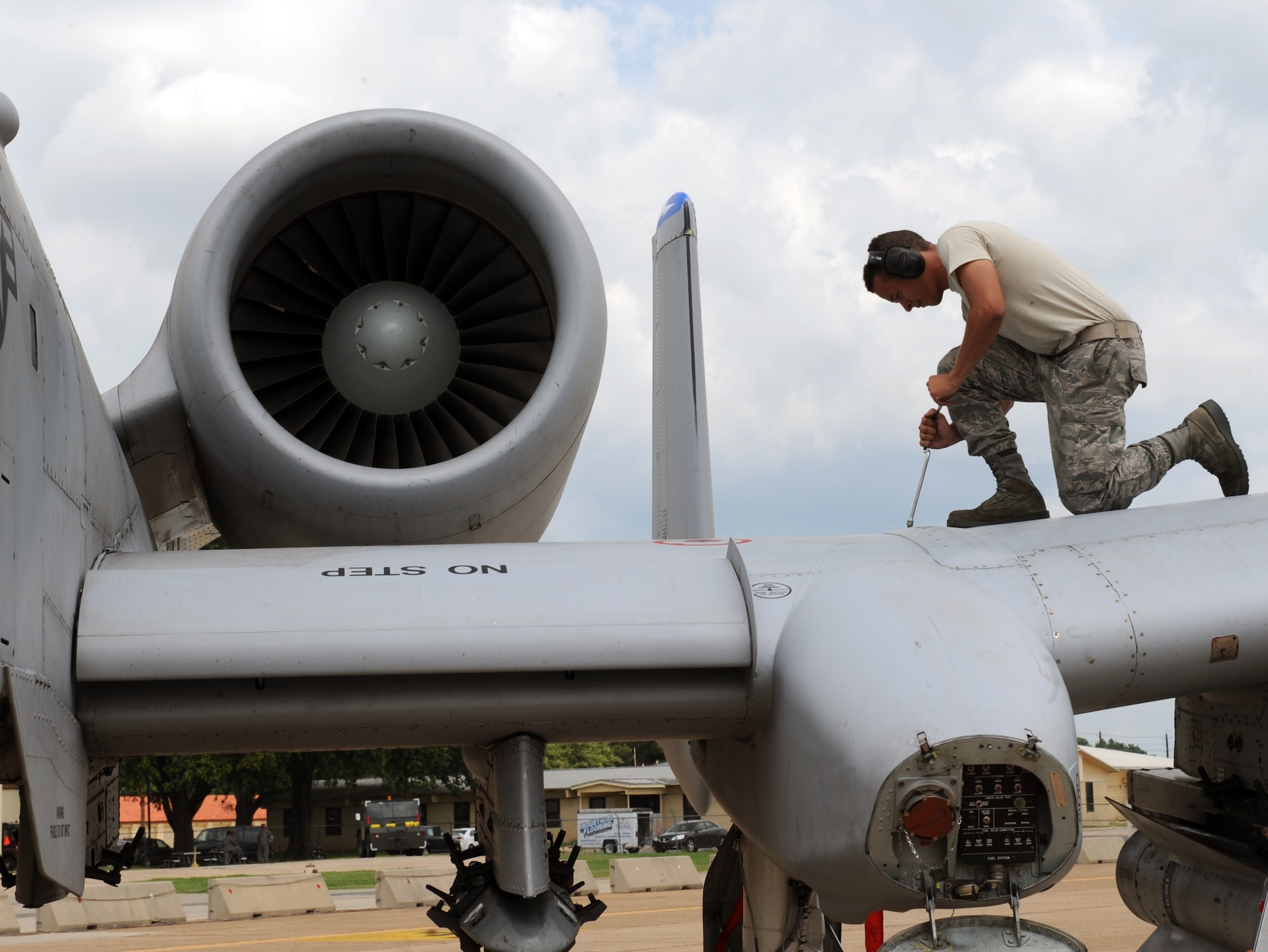 Airman 1st Class Alejandro Cordero, a crew chief from Moody Air Force Base, Ga., tightens a bolt on an A-10 Thunderbolt II fighter on Barksdale Air Force Base, La., June 4, 2013. During flight, nuts and bolts come loose because of vibrations from the plane. Crew chiefs must ensure all nuts and bolts are tightened or replaced after flight. (U.S. Air Force photo/Airman 1st Class Benjamin Gonsier)