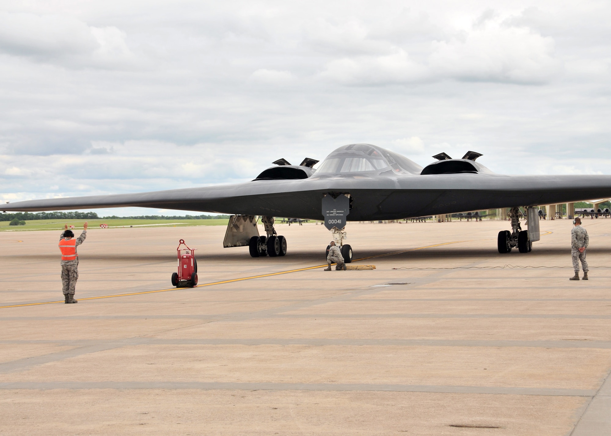 The B-2 "Spirit of Hawaii"  is recovered by members of the 131st Bomb Wing, Missouri Air National Guard,at Whiteman AFB., June 1, 2013.  Onboard, pilot Lt.Col Michael Means on his final flight before his retirement.  Means holds the B-2 flying hours record for the Air National Guard with 1765.8 hours and is second ranking of both active and guard pilots (retired and currently flying). (U.S. Air National Guard Photo by Senior Master Sgt. Mary-Dale Amison/RELEASED)