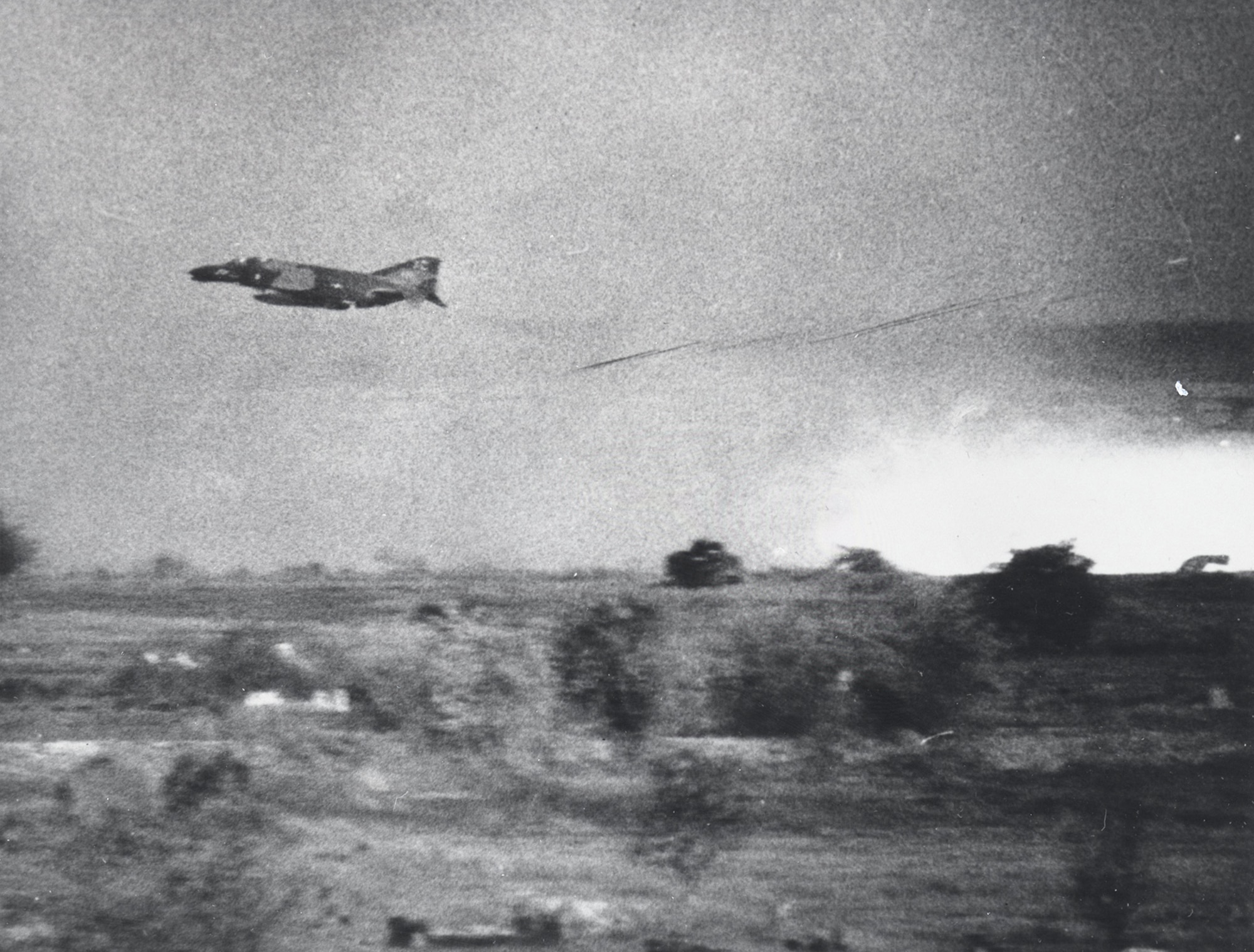 An F-4C from the 12th Tactical Fighter Wing delivers close air support to armored vehicles in South Vietnam during April 1969. (U.S. Air Force photo)