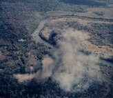 An F-100 finishes its attack on an enemy target. Depending on the type of target, F-100s could deliver a deadly mixture of conventional bombs, cluster bombs, rockets and napalm. They could also strafe enemy forces with their four devastating 20mm cannon. (U.S. Air Force photo)
