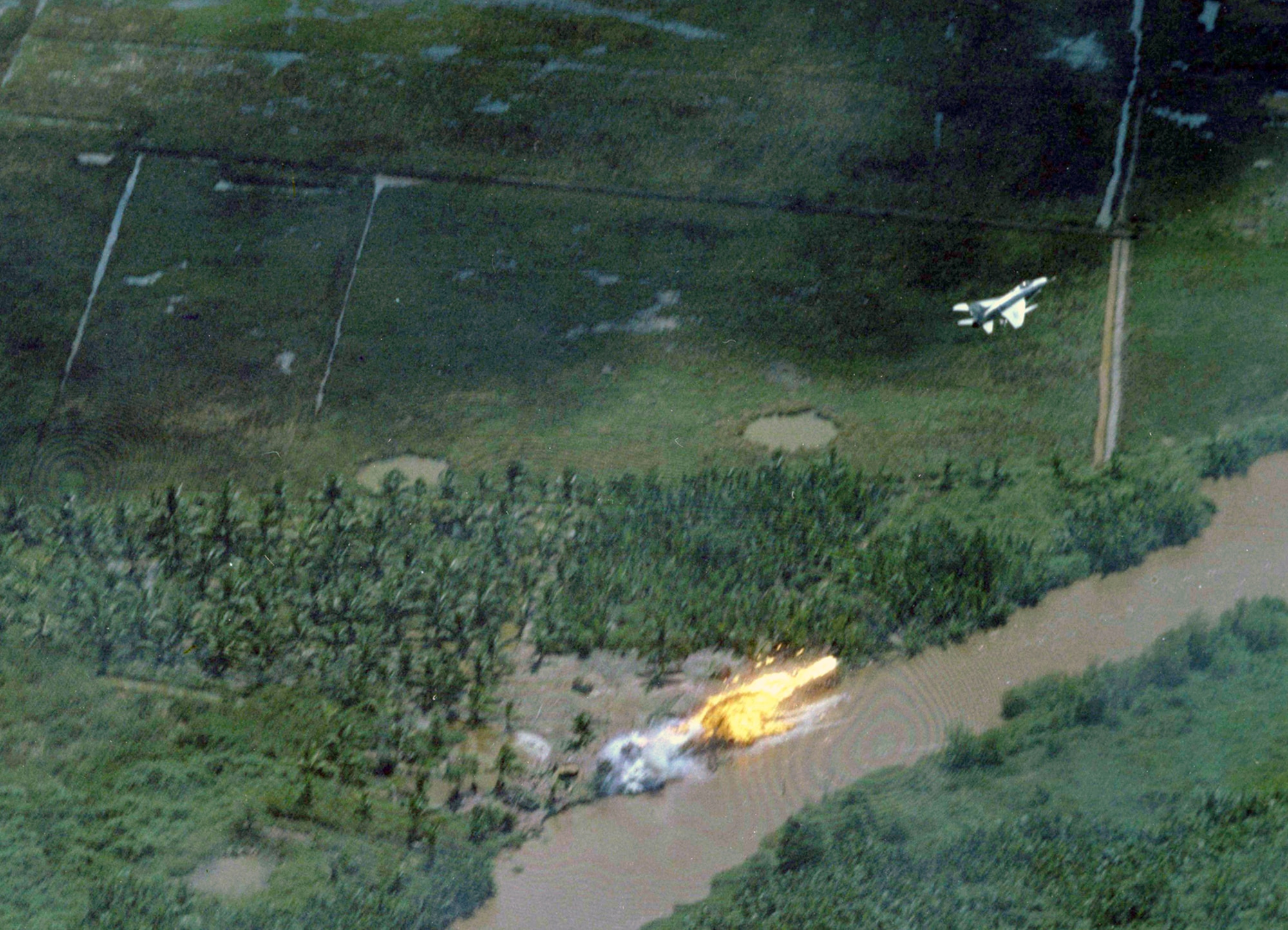 This F-100 pilot from the 90th Tactical Fighter Squadron targeted communist forces in South Vietnam with napalm in March 1966. (U.S. Air Force photo)