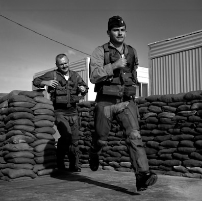 To provide close air support as quickly as possible, the USAF kept strike aircraft and aircrews on alert. Here, Maj. Anthony Sheehan (front) and Capt. James McNeil run from their alert hut to their armed and waiting F-100s at Phan Rang Air Base in 1967. (U.S. Air Force photo)