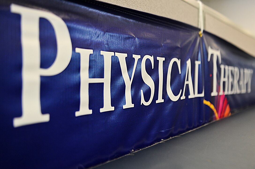 A physical therapy banner sits next to a table at the Physical Training building on Hurlburt Field, Fla., May 29, 2013. On average, technicians see 25 to 30 patients on daily. (U.S. Air Force photo/Airman 1st Class Christopher Callaway) 