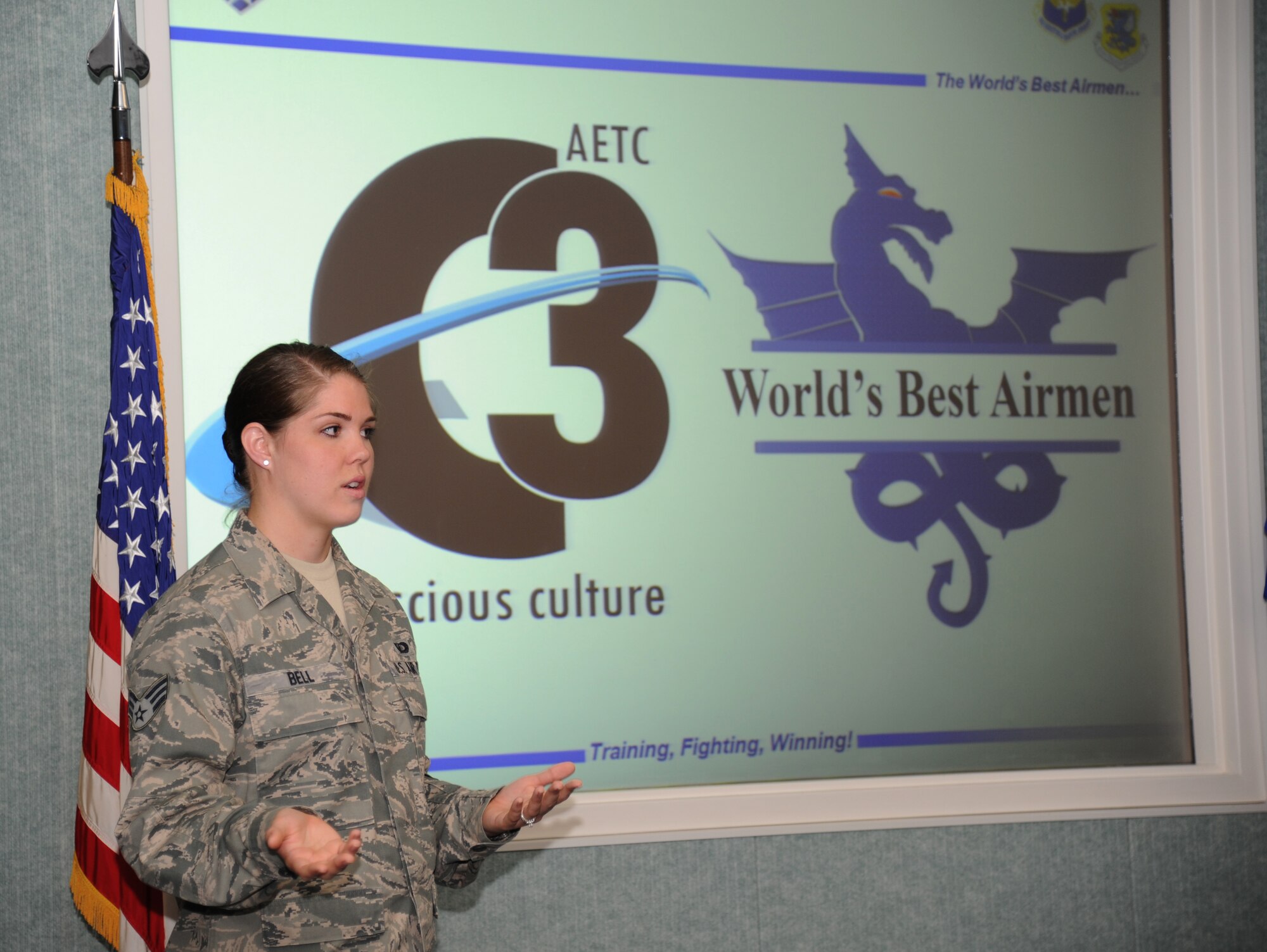 Senior Airman Amber Bell, 81st Comptroller Squadron, leads a briefing as Keesler's Cost Conscious Culture program manager at the first C3 initiative group meeting June 5, 2013, at the 81st Communications Squadron, Keesler Air Force Base, Miss.  This program promotes personal involvement and understanding about the everyday costs of Keesler’s mission.  (U.S. Air Force photo by Kemberly Groue)