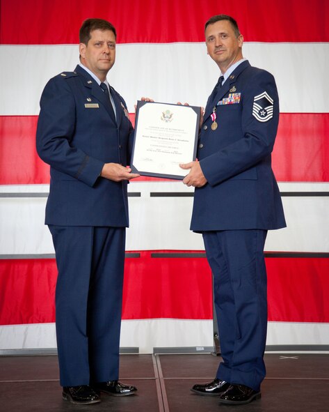 Lt. Col. Marvin Schaitel, 934th Maintence Group deputy commander, presents Senior Master Sgt. Reno Stradiotto, 934th Maintenance Group, with his certificate of retirement on June 1.  SMSgt. Stradiotto retires after over 24 years of service from the Minneapolis-St. Paul Air Reserve Station, Minn.  (U.S. Air Force photo/Shannon McKay)