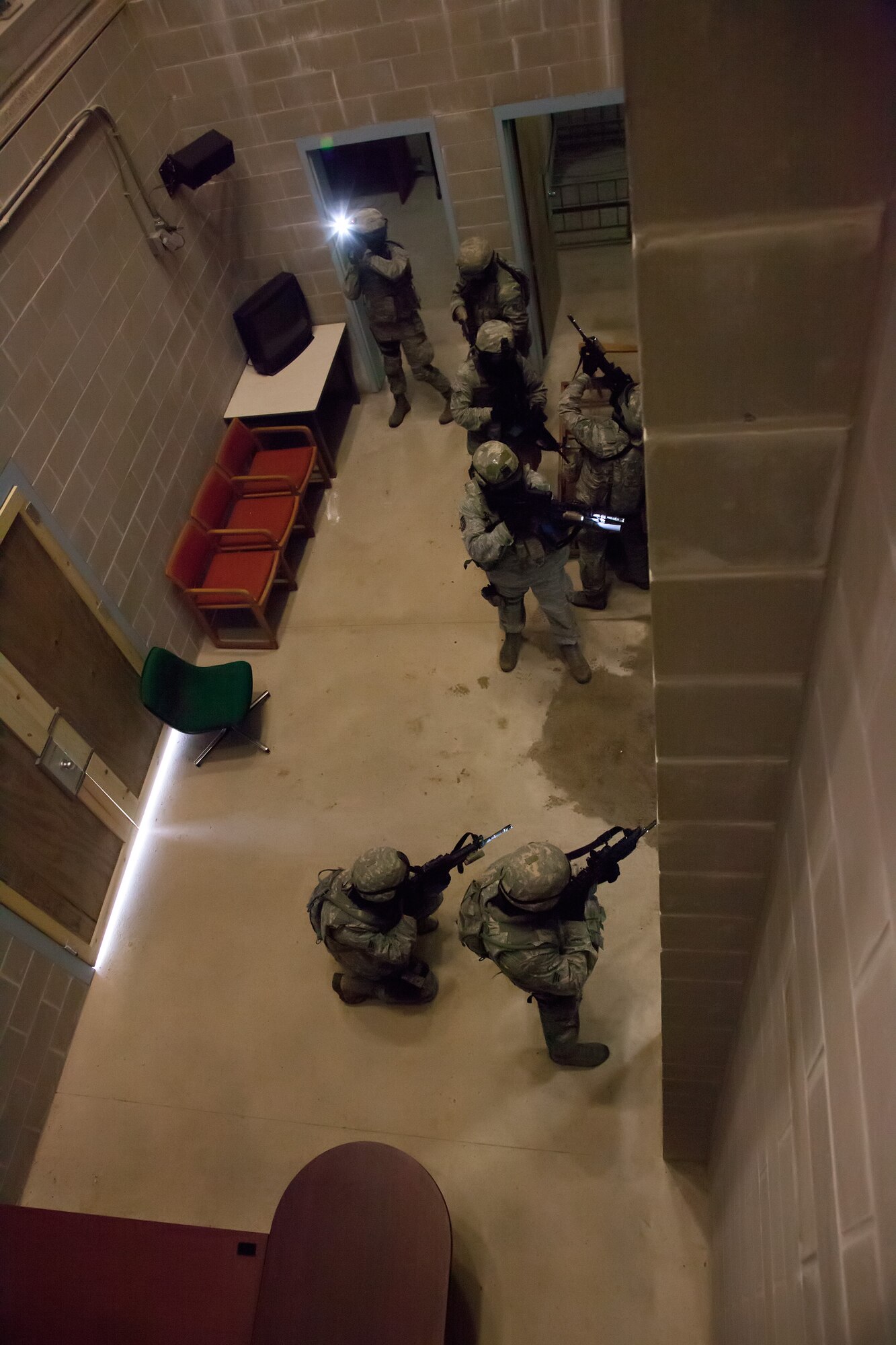 Members of the 934th Security Forces Squadron clear a building during a training exercise May 31 at Camp Ripley, Minn.  (U.S. Air Force photo/Shannon McKay)