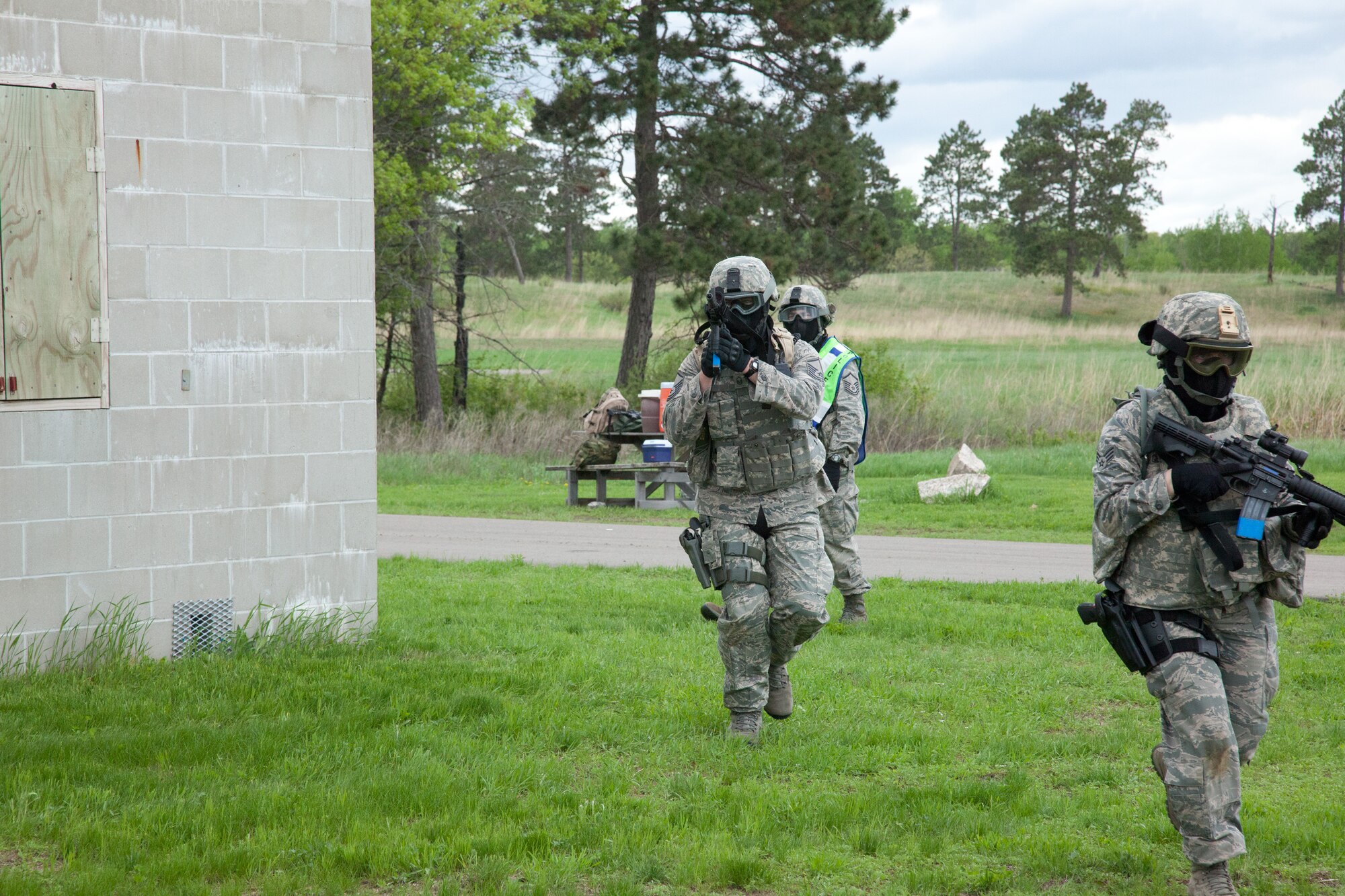 Members of the 934th Security Forces Squadron clear a "town" during a training exercise May 31 at Camp Ripley, Minn.  (U.S. Air Force photo/Shannon McKay)