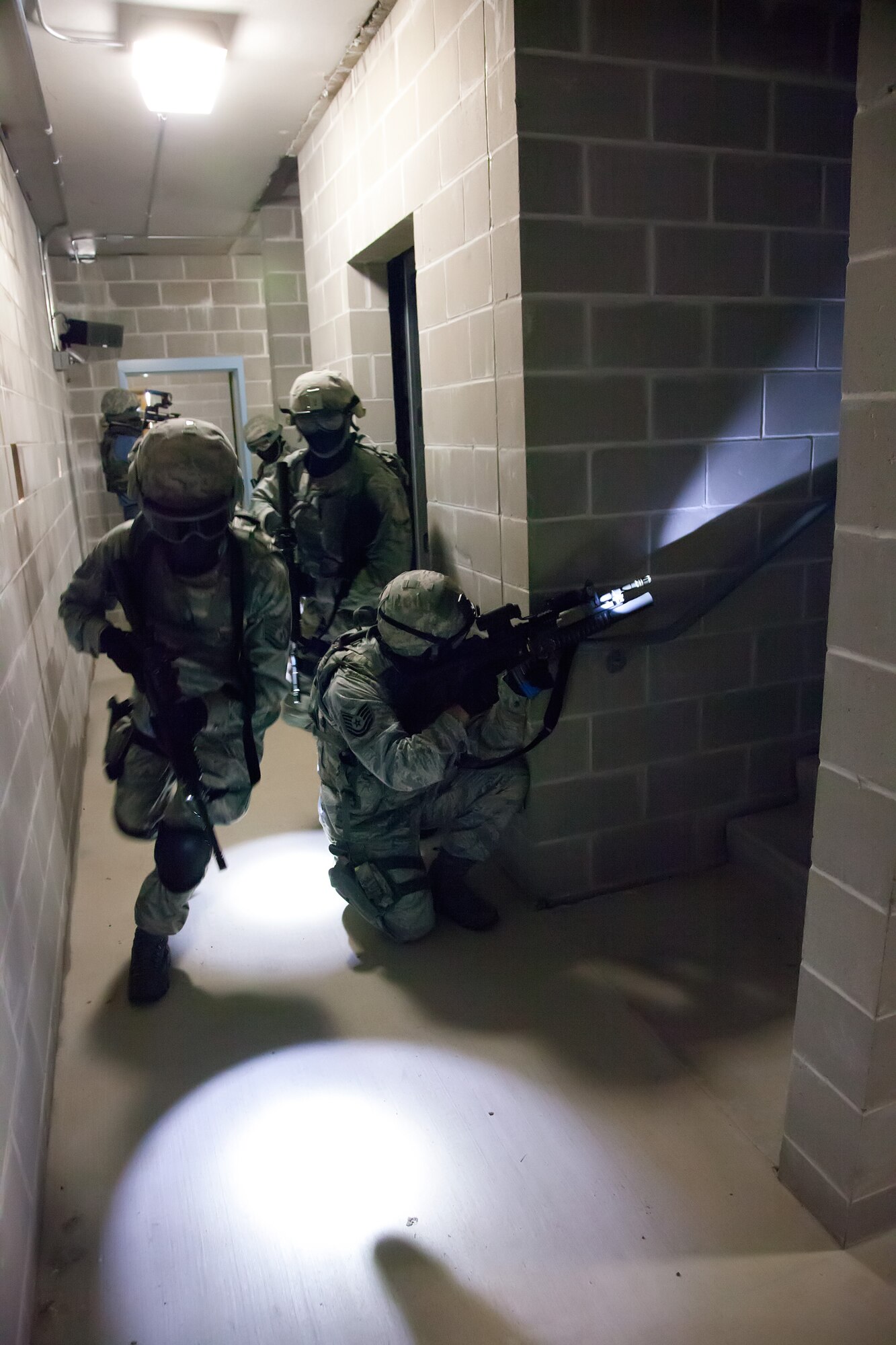 Members of the 934th Security Forces Squadron clear a building during a training exercise May 31 at Camp Ripley, Minn.  (U.S. Air Force photo/Shannon McKay)