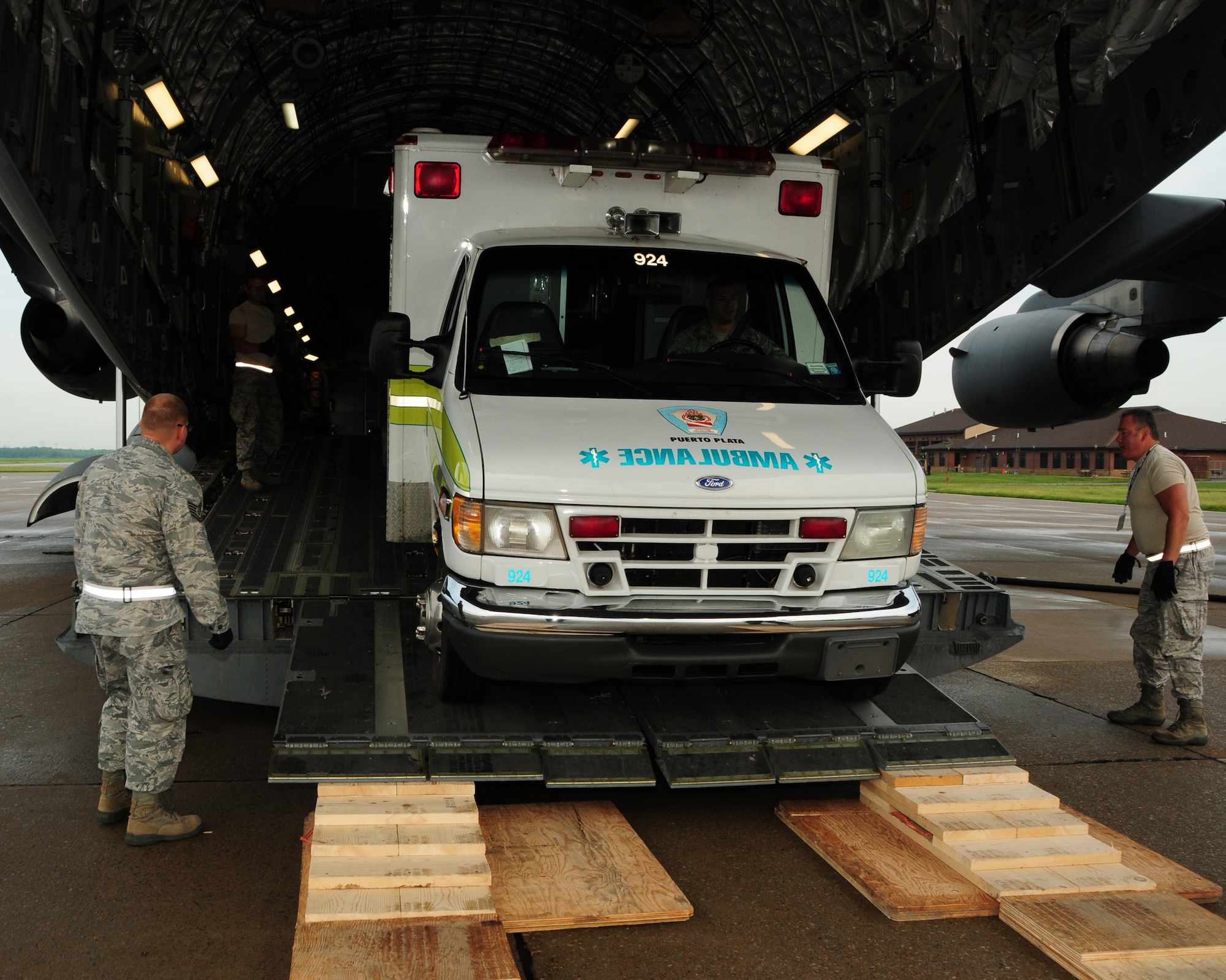 An ambulance is loaded on board a C-17 aircraft at the Niagara Falls Air Reserve Station, N.Y. May 29, 2013 by members of the 30th Aerial Port Squadron. The ambulance, part of a Denton Cargo load was flown to the Dominican Republic via a training mission of the 452nd Air Mobility Wing, March Air Reserve Base, Calif. (U.S. Air Force Photo by Peter Borys)