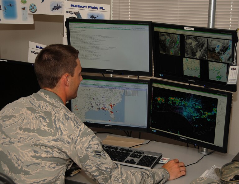 Airman 1st Class Ryan Bielli, a 26th Operational Weather Squadron weather forecaster, monitors possible inclement weather patterns for Region 2 on Barksdale Air Force Base, La., June 4, 2013.  The 26th OWS monitors 13 states to predict potential weather patterns that can impact the Barksdale mission and the base populace. (U.S. Air Force photo/Staff Sgt. Jason McCasland)