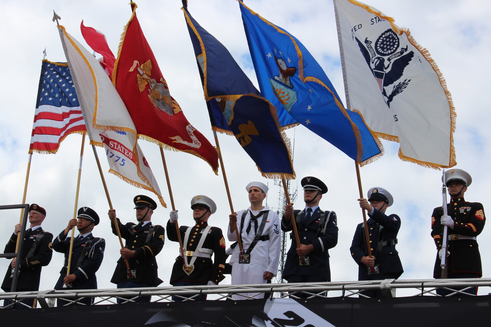 130601-Z-NV943-173: A Joint Honor Guard consisting of Army, Air Force, Marine Corps, Navy and Coast Guard members presents the colors during pre-race festivities on June 2, 2013, during the 2013 Chevrolet Detroit Belle Isle Grand Prix. More than 50 military members from the various branches and units at Selfridge Air National Guard Base, Mich., took part in five volunteer events over the race weekend. Grand Prix officials invited the military members to participate in the events to show their appreciation for their service. (U.S. Air National Guard photo by Angela Pope/Released)