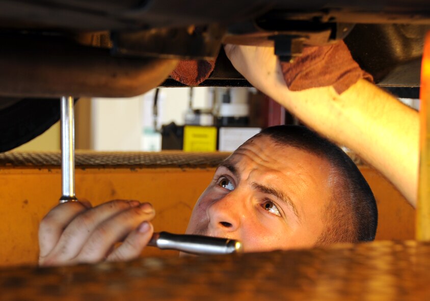 Airman 1st Class Alec Steinert, 2nd Aircraft Maintenance Squadron hydraulics, removes bolts from a starter at the Auto Hobby Shop on Barksdale Air Force Base .,June 3, 2013.   The Auto Hobby Shop provides a do-it-yourself location for car enthusiasts to care for their vehicles and avoid possible costly repairs in the future.  (U.S. Air Force photo/Staff Sgt. Jason McCasland)