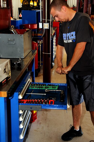 Airman 1st Class Alec Steinert, 2nd Aircraft Maintenance Squadron hydraulics, changes a socket at the Auto Hobby Shop on Barksdale Air Force Base, La., June 3, 2013. The Auto Hobby Shop provides regular and specialized tools for the do-it-yourselfer to care for their vehicles and avoid possible costly repairs in the future.  (U.S. Air Force photo/Staff Sgt. Jason McCasland)