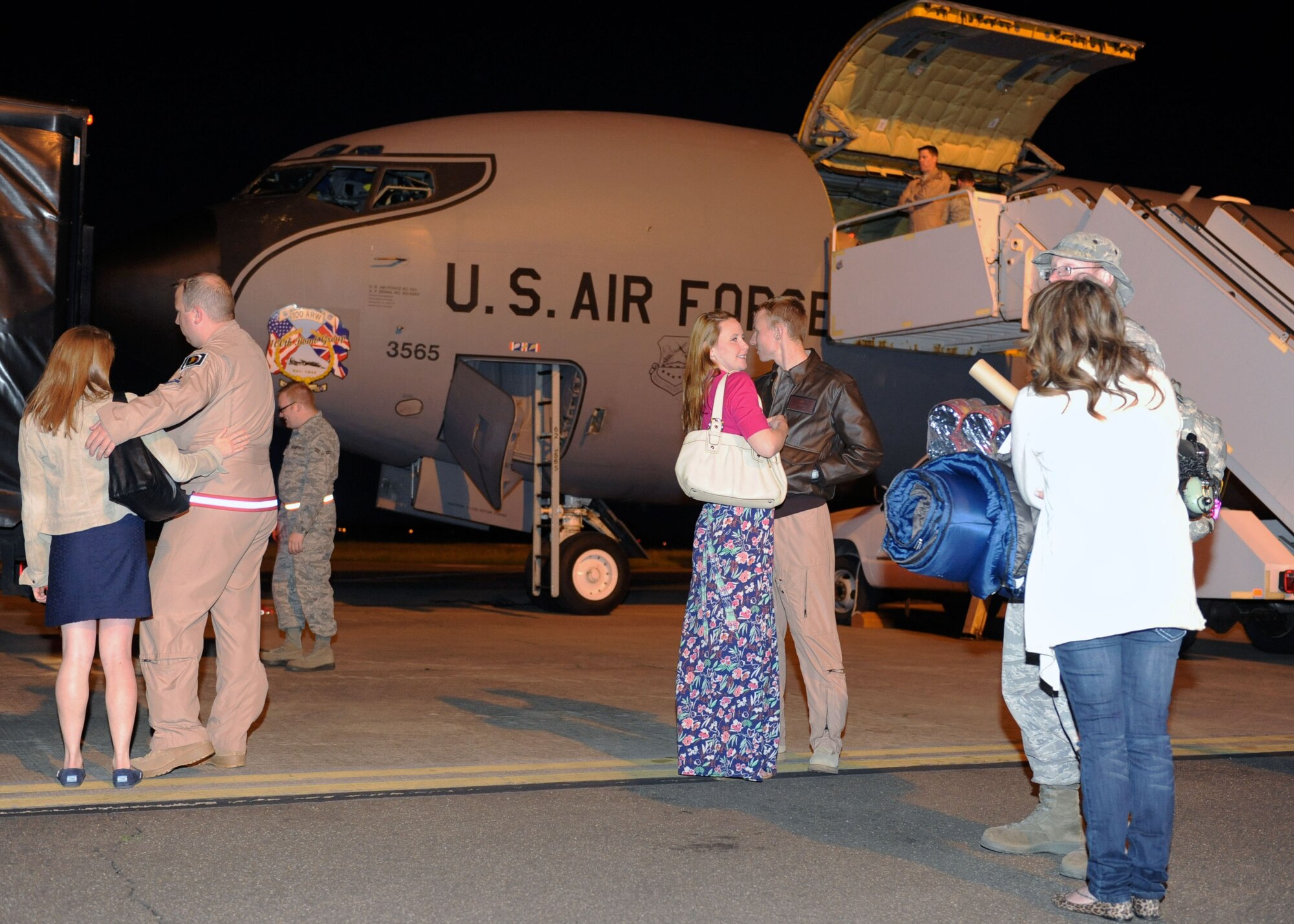 Team Mildenhall members greet their Airmen June 3, 2013, on the flightline on RAF Mildenhall, England. The Airmen were finally reunited with their family and friends after returning home from a deployment to Moron Air Base, Spain, supporting French operations in Mali. (U.S. Air Force photo by Airman 1st Class Preston Webb/Released)