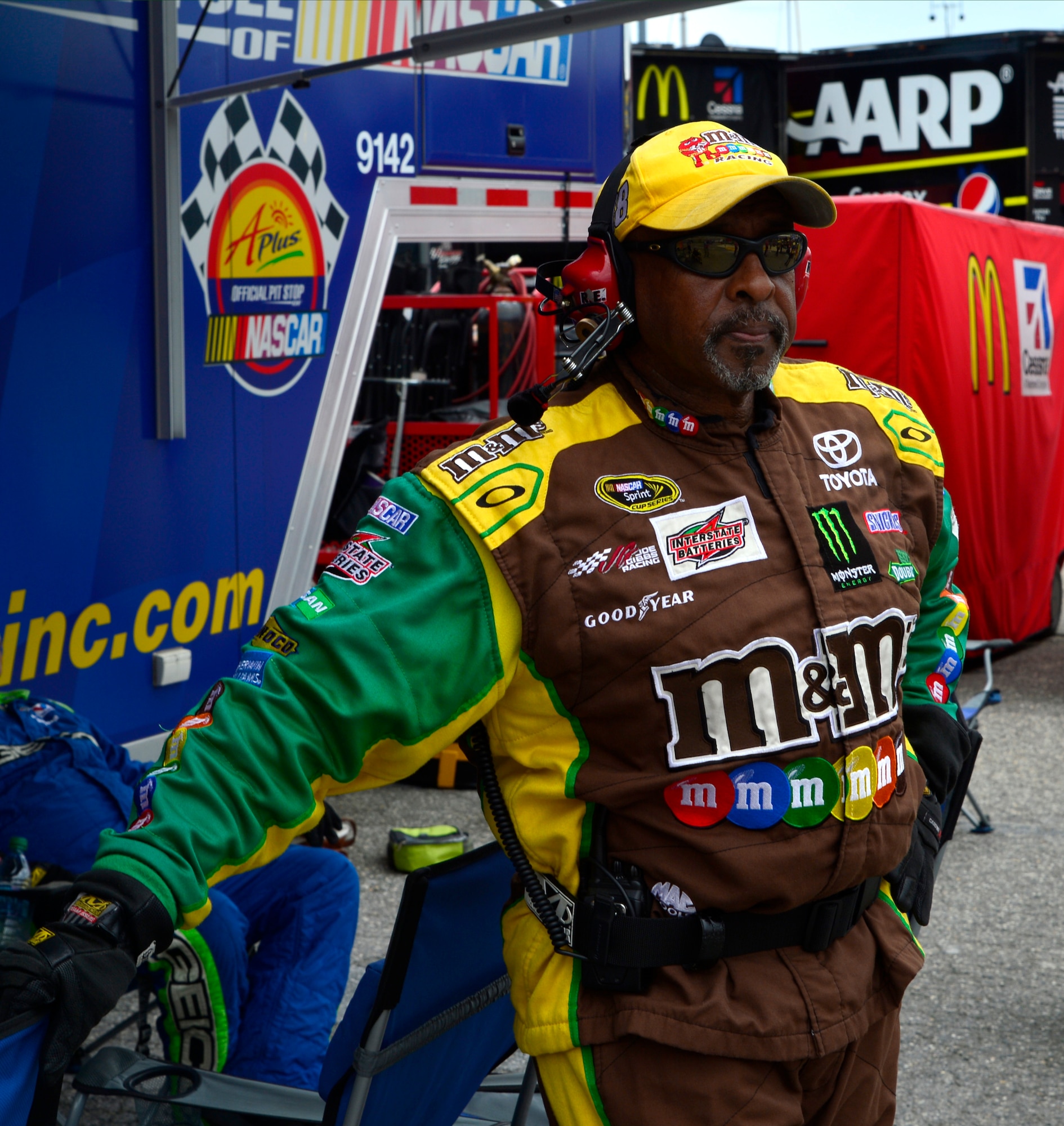 A pit crew member for Kyle Busch, driver of the No. 18 M&Ms Toyota, takes a break during the Fed Ex 400 Benefiting Autism Speaks June 2, 2013, at Dover International Speedway in Dover, Del. Busch ended up finishing the race in fourth place. (U.S. Air Force photo/David Tucker)