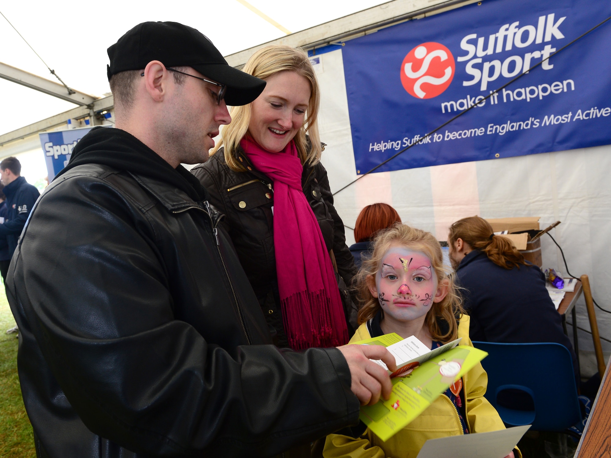 IPSWICH, England -- Geoffrey Miller, 48th Aerospace Medicine Squadron health and wellness center exercise physiologist, encourages mother Zoe and daughter Lilly Hawkins to participate in the family health trail at the Suffolk Show May 30, 2013. The 48th AMDS public health and HAWC are working with Healthy Ambitions to promote and educate families to live a healthy lifestyle. Healthy Ambitions goal is to make Suffolk the healthiest county by 2028. (U.S. Air Force photo by Staff Sgt. Stephanie Mancha)