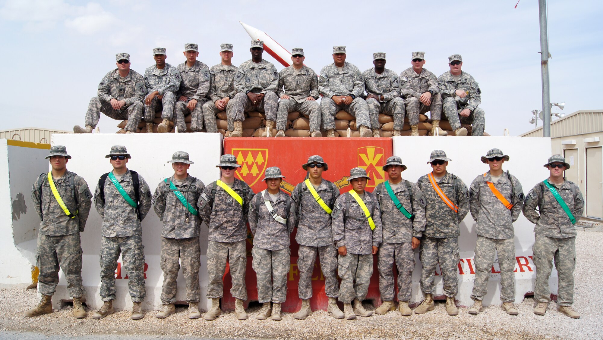 All participants and their evaluators gather for a group photo before the conclusion of the 1-43 Air Defense Artillery Battalion’s recent “Best Cobra Competition” at the 379th Air Expeditionary Wing in Southwest Asia. (U.S. Army photo/Sgt. Daniel J. Baylor)