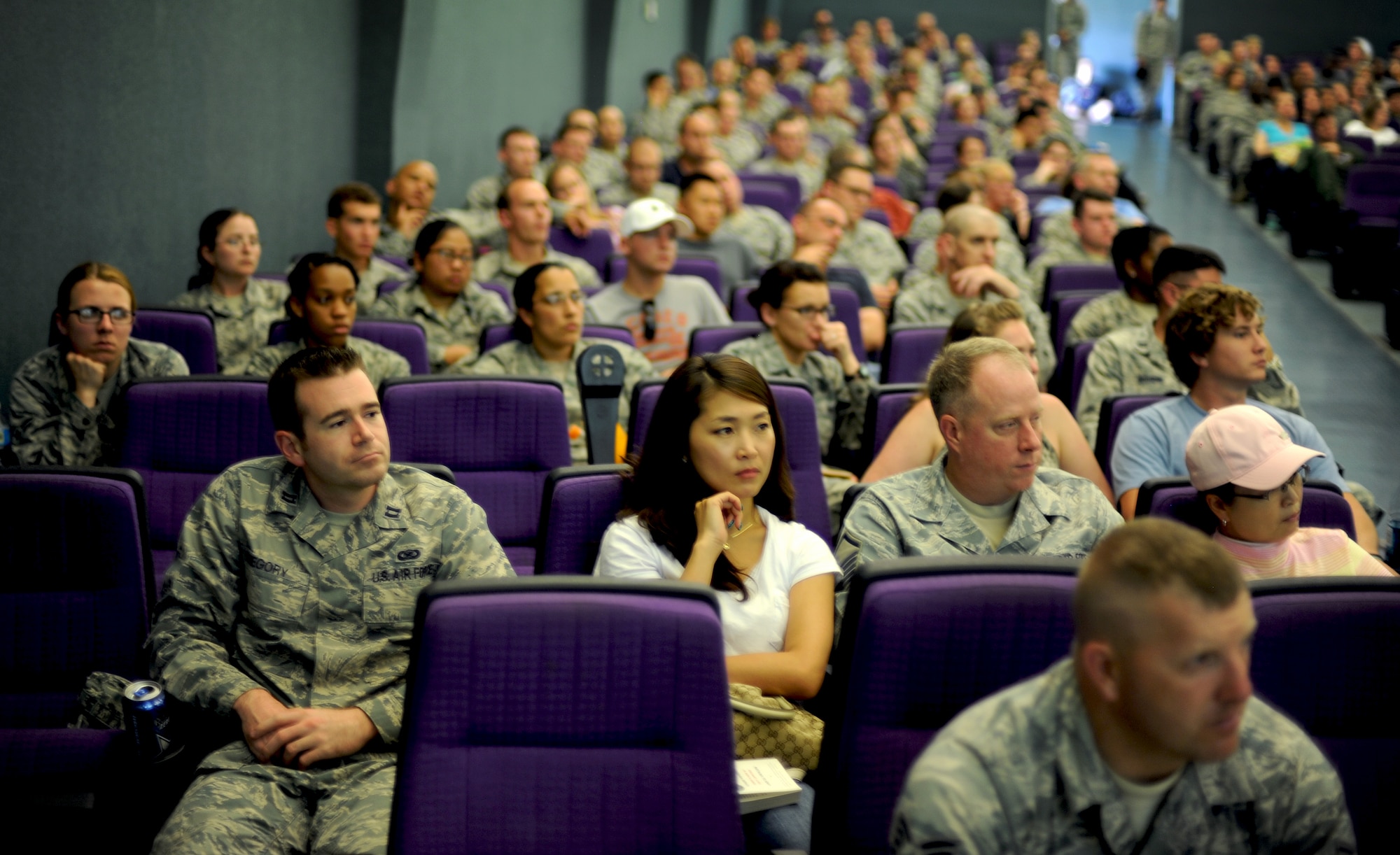 Airmen and their families watch Kim Hyuk, North Korean defector and public speaker, and listen to his story of living in North Korea and eventually stealing his freedom by defecting to the Republic of Korea at the base theater on Osan Air Base, ROK, May 31, 2013. Hyuk and the Citizens’ Alliance for North Korean Human Rights visited Osan to speak with members of the base during a three-part informative seminar that helped people in Korea better understand the current situation in North Korea. (U.S. Air Force photo/Staff Sgt. Sara Csurilla)