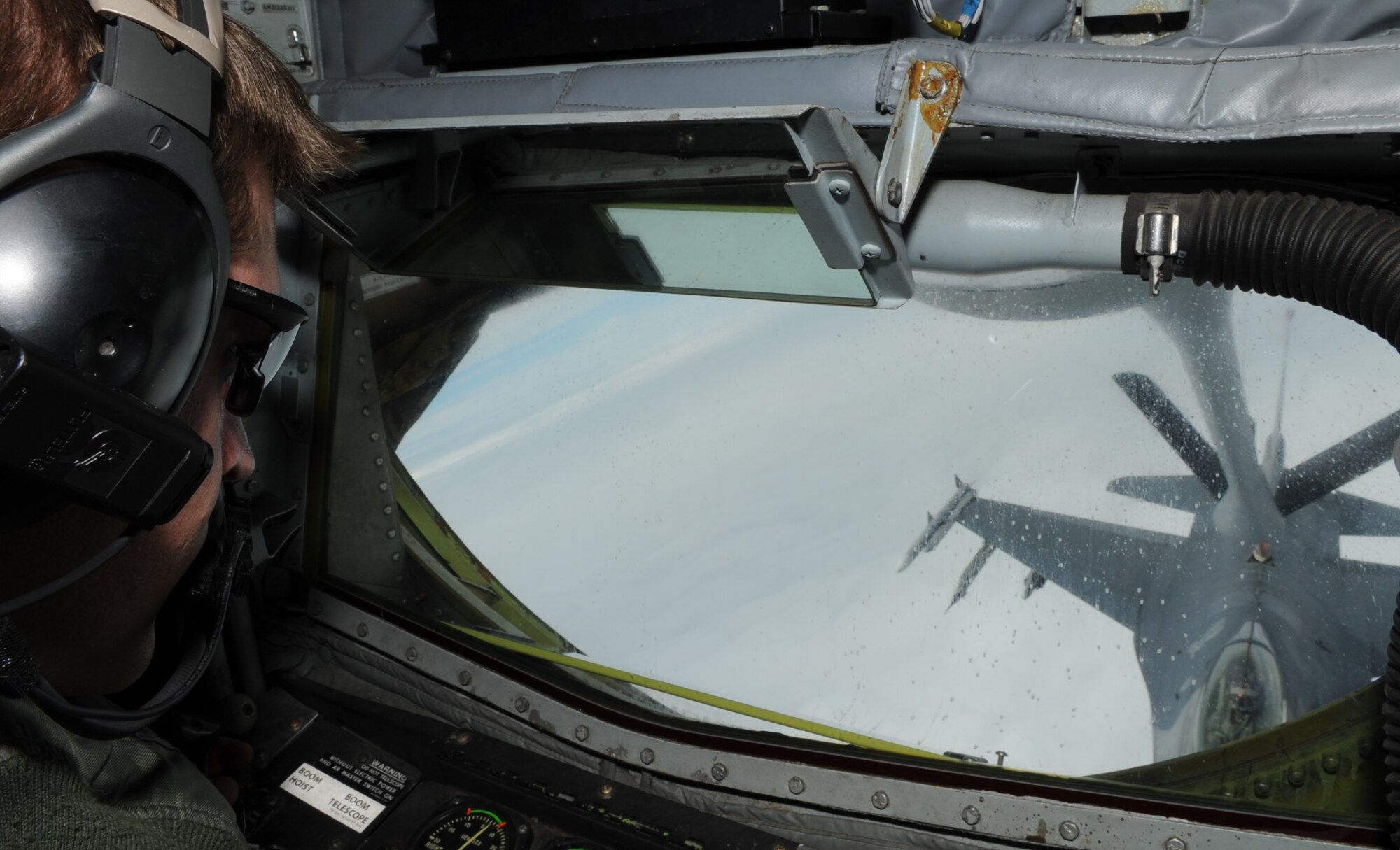 U.S. Air Force Staff Sgt. Jeremy Hall, 909th Air Refueling Squadron boom operator refuels an F-16 Fighting Falcon during training over the Pacific, May 29, 2013. Refueling training missions, such as these, are conducted to maintain operational readiness in support of the 18th Wing and its mission.  (U.S. Air Force photo by Airman 1st Class Keith A. James/Released)