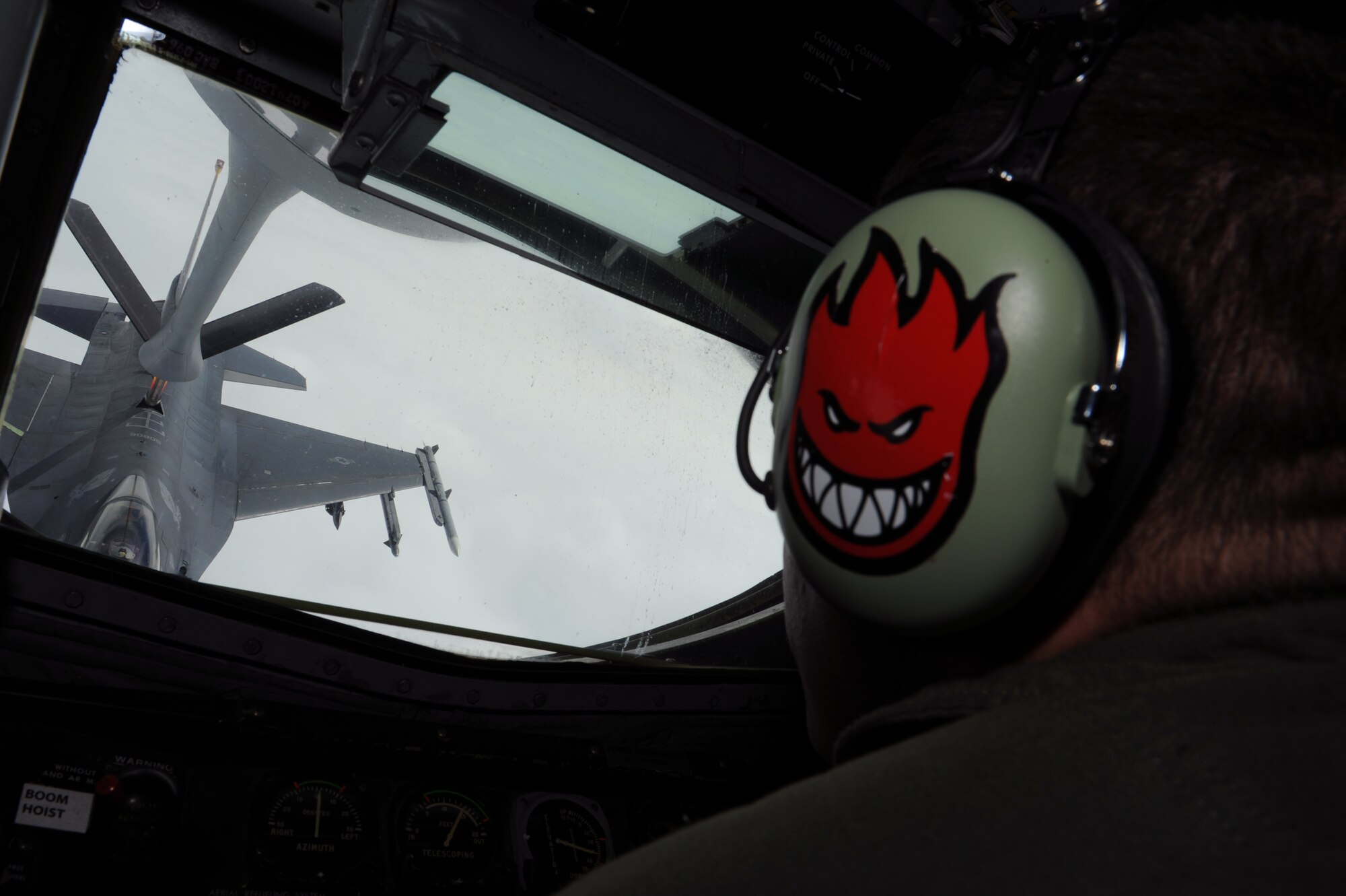 U.S. Air Force Staff Sgt. Christopher Huber, 909th Air Refueling Squadron B flight chief refuels an F-16 Fighting Falcon during training over the Pacific, May 29, 2013. The 909th ARS stays mission ready by conducting weekly missions that provide refueling capabilities throughout the Pacific Region. (U.S. Air Force photo by Airman 1st Class Keith A. James/Released)