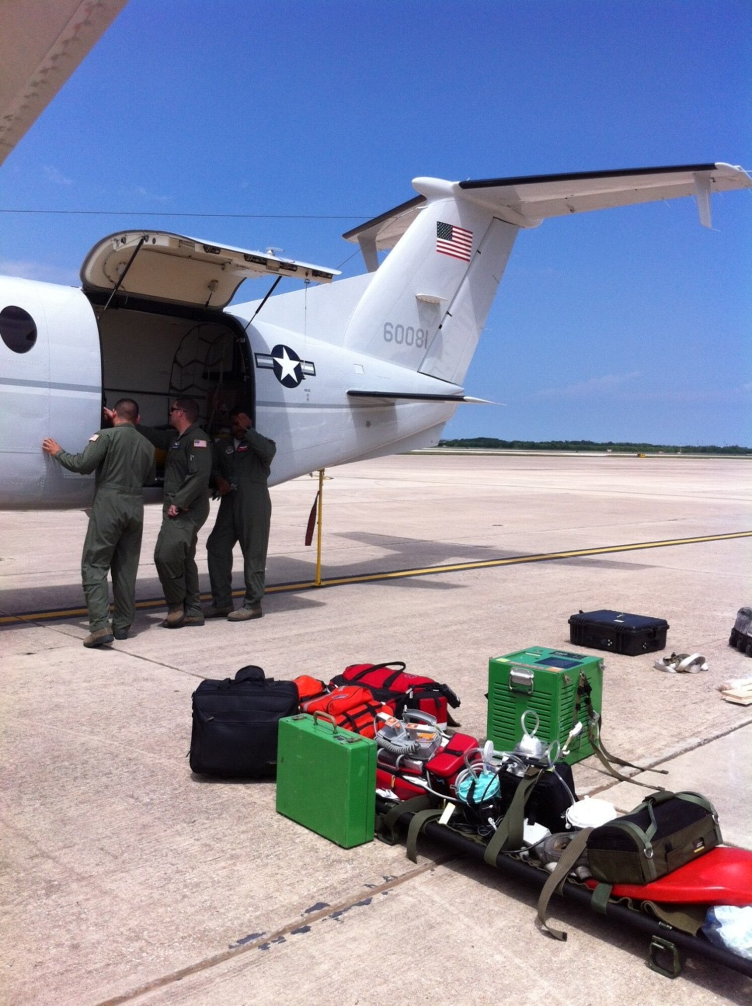 Airmen begin to fit a C-12 Huron aircraft with aeromedical evacuation equipment in order for the aircraft to be certified. After certification, the C-12 will be able to perform aeromedical evacuations in the Pacific region. (Courtesy photo)